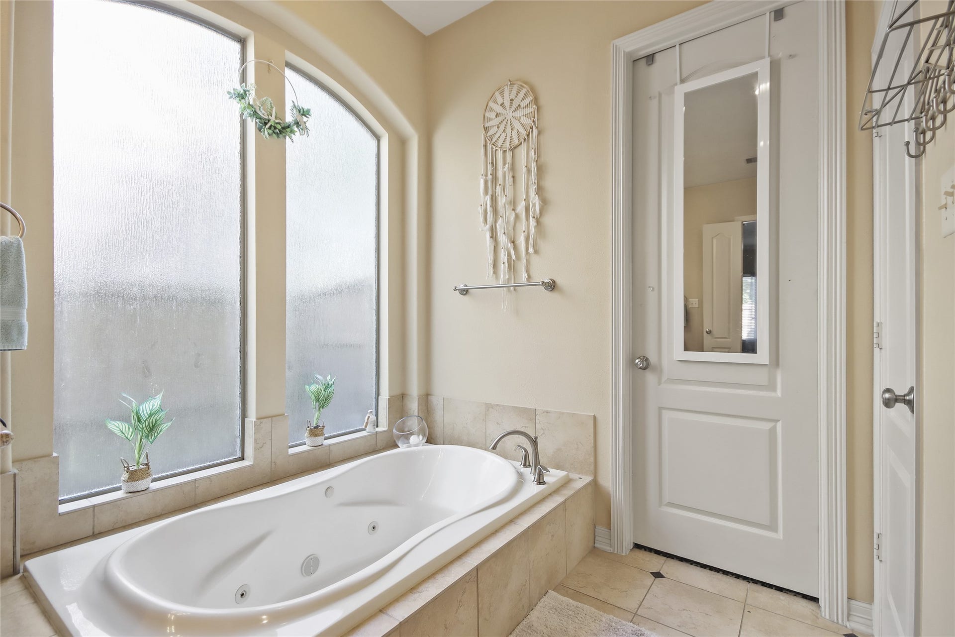 27906 Iberville Glen Dr, Katy, TX 77494 This jet tub is framed by large frosted windows offering privacy and natural light.