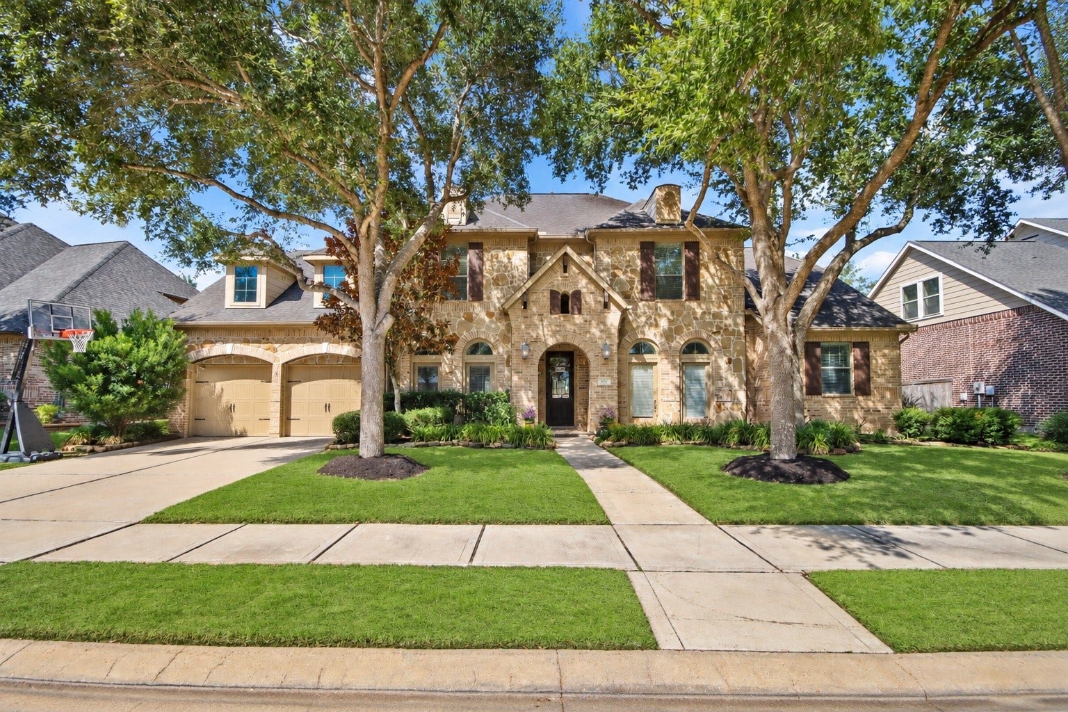 27906 Iberville Glen Dr, Katy, TX 77494 Beautiful stunning two-story home, features a mix of brick and stone facade. A welcoming front entry with a charming walkway that leads right to the inviting entrance.