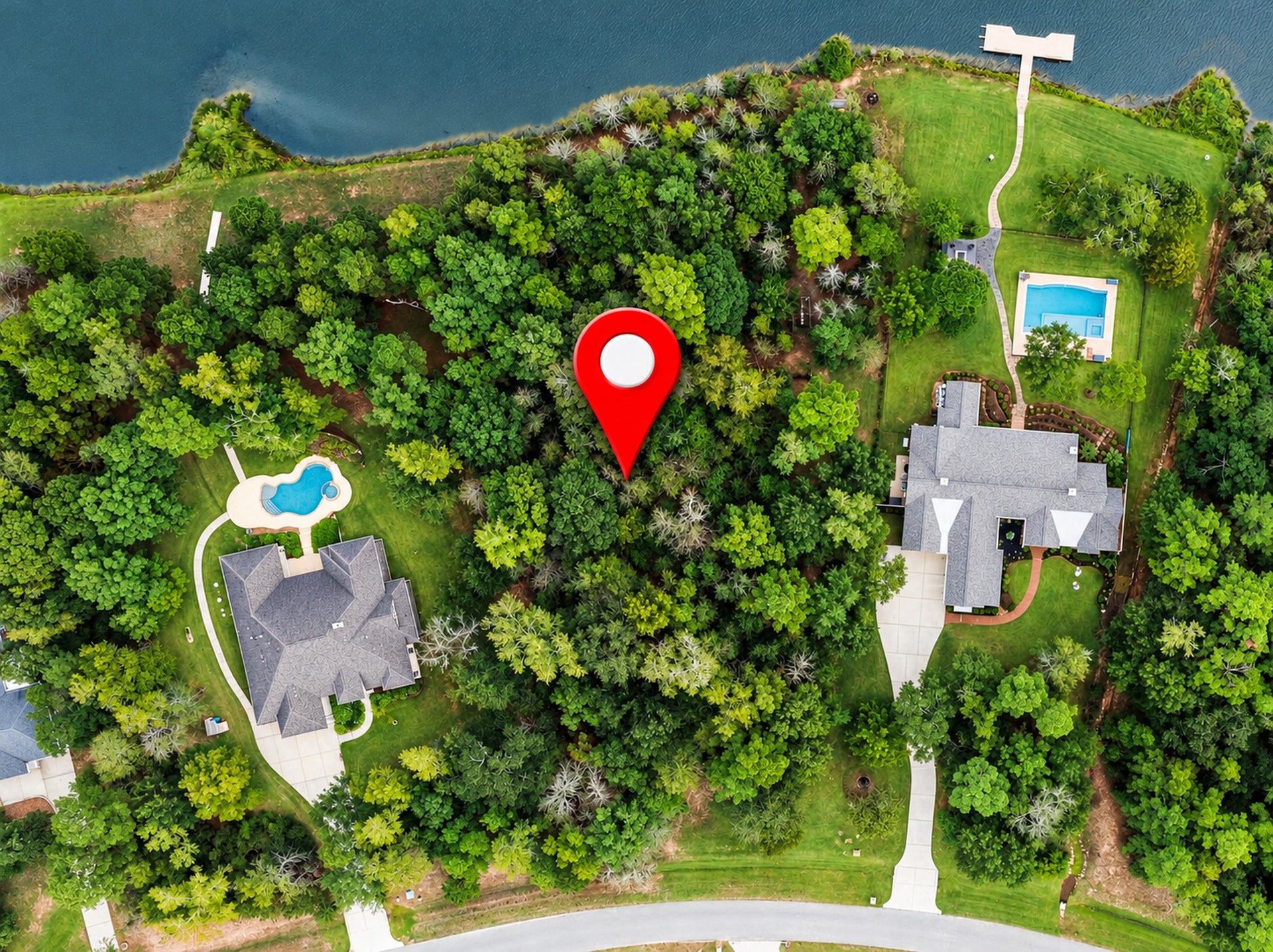 236 Lakeside Hills Drive, Montgomery, TX 77316 A beautiful high-and-dry wooded lot on the shores of Ridge Lake.