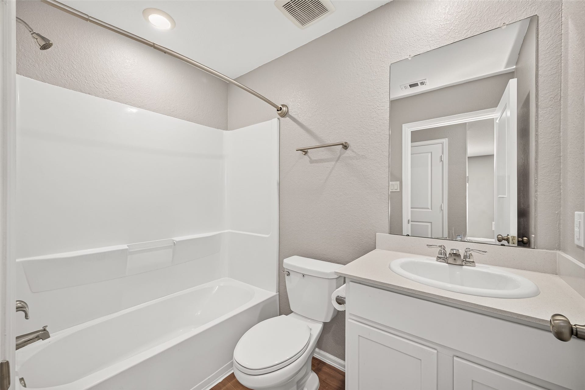 19494 Rosali Meadow Drive, New Caney, TX 77357 Primary en suite bathroom featuring a sleek vanity, pristine bathtub, and neutral wall tones for a fresh, inviting atmosphere.