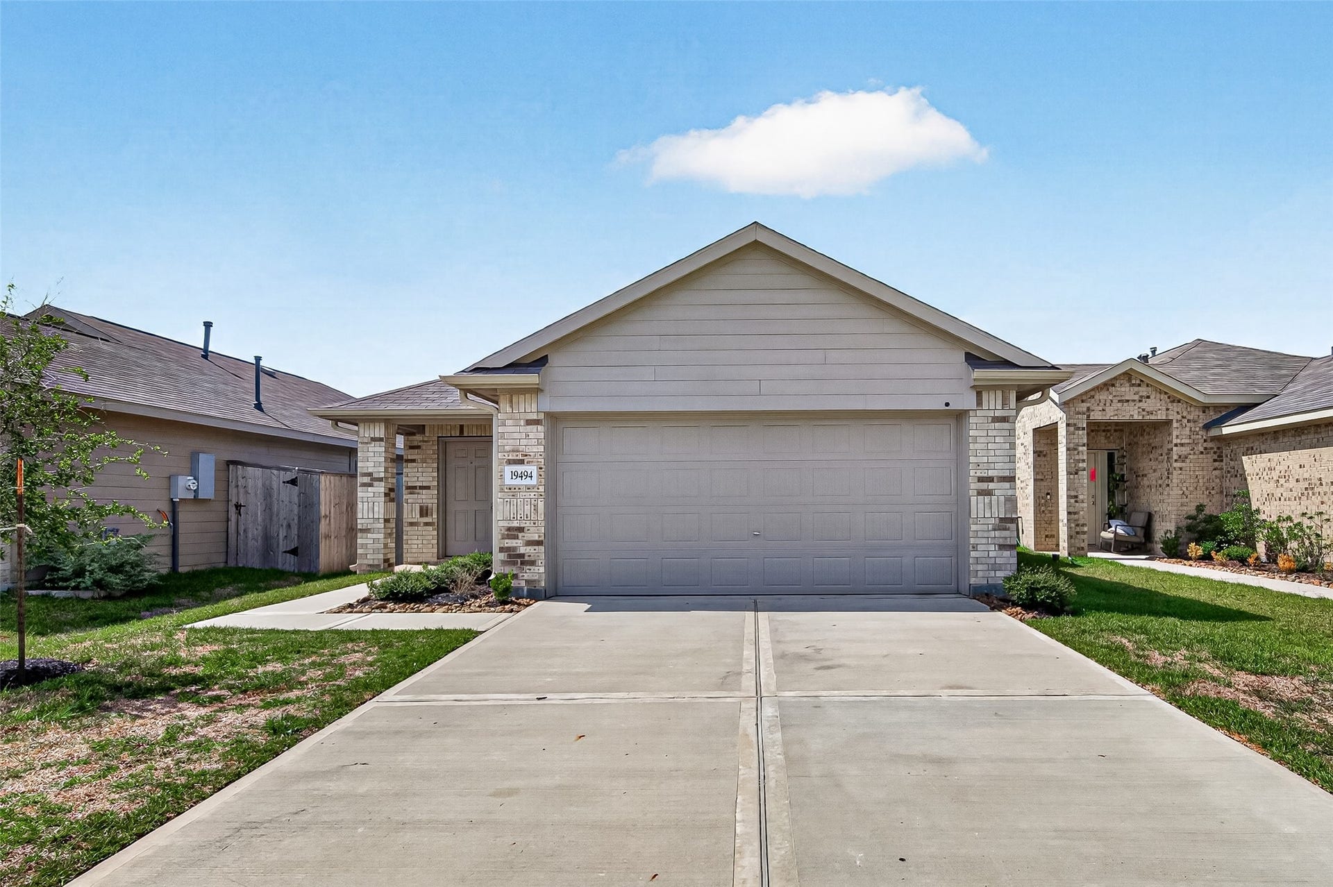 19494 Rosali Meadow Drive, New Caney, TX 77357 Charming single-story home with a spacious two-car garage and neatly landscaped front yard, offering excellent curb appeal in a welcoming neighborhood.