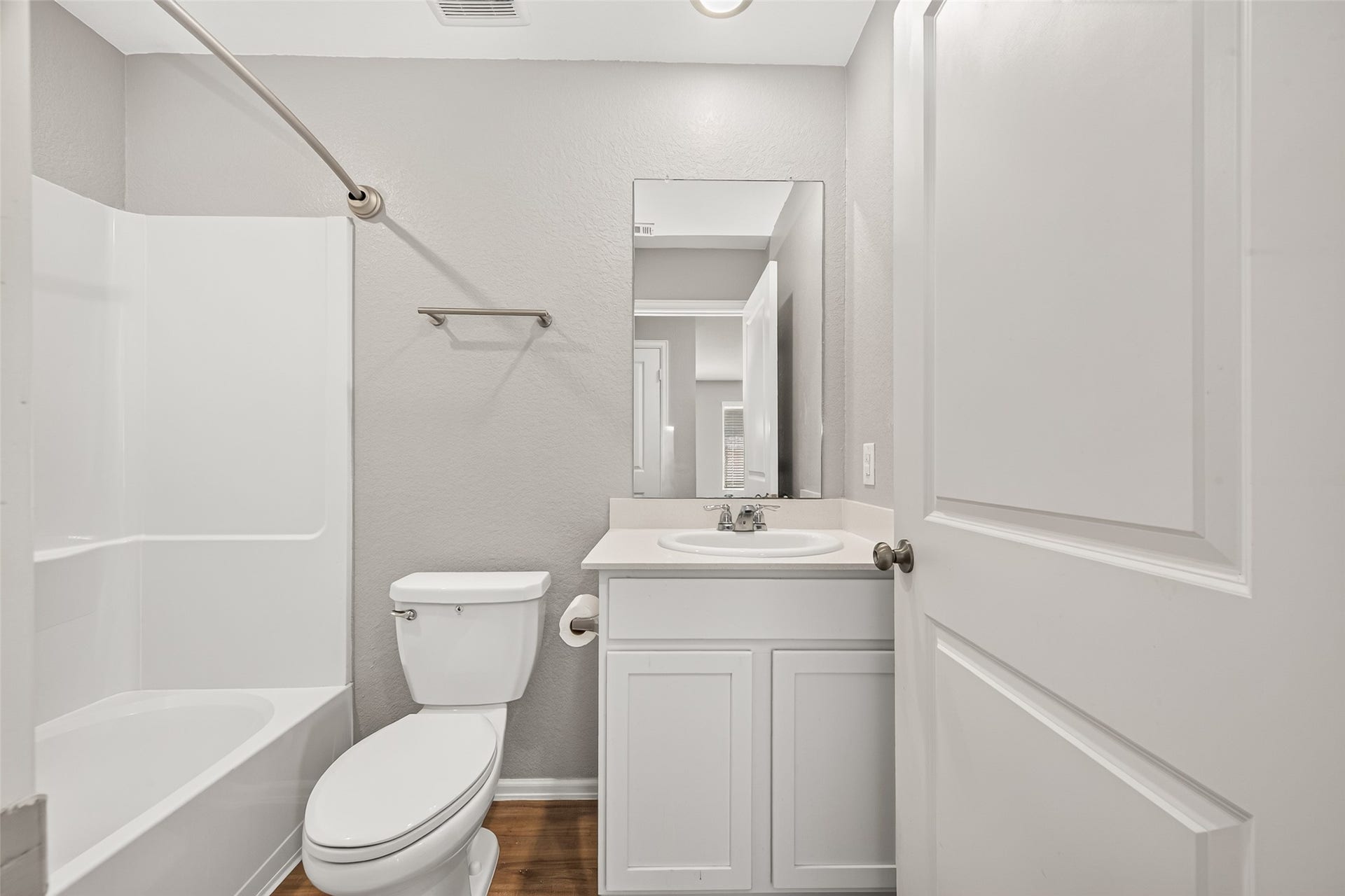19494 Rosali Meadow Drive, New Caney, TX 77357 Bright and modern bathroom featuring a sleek vanity, bathtub-shower combo, and neutral tones for a clean and inviting space.