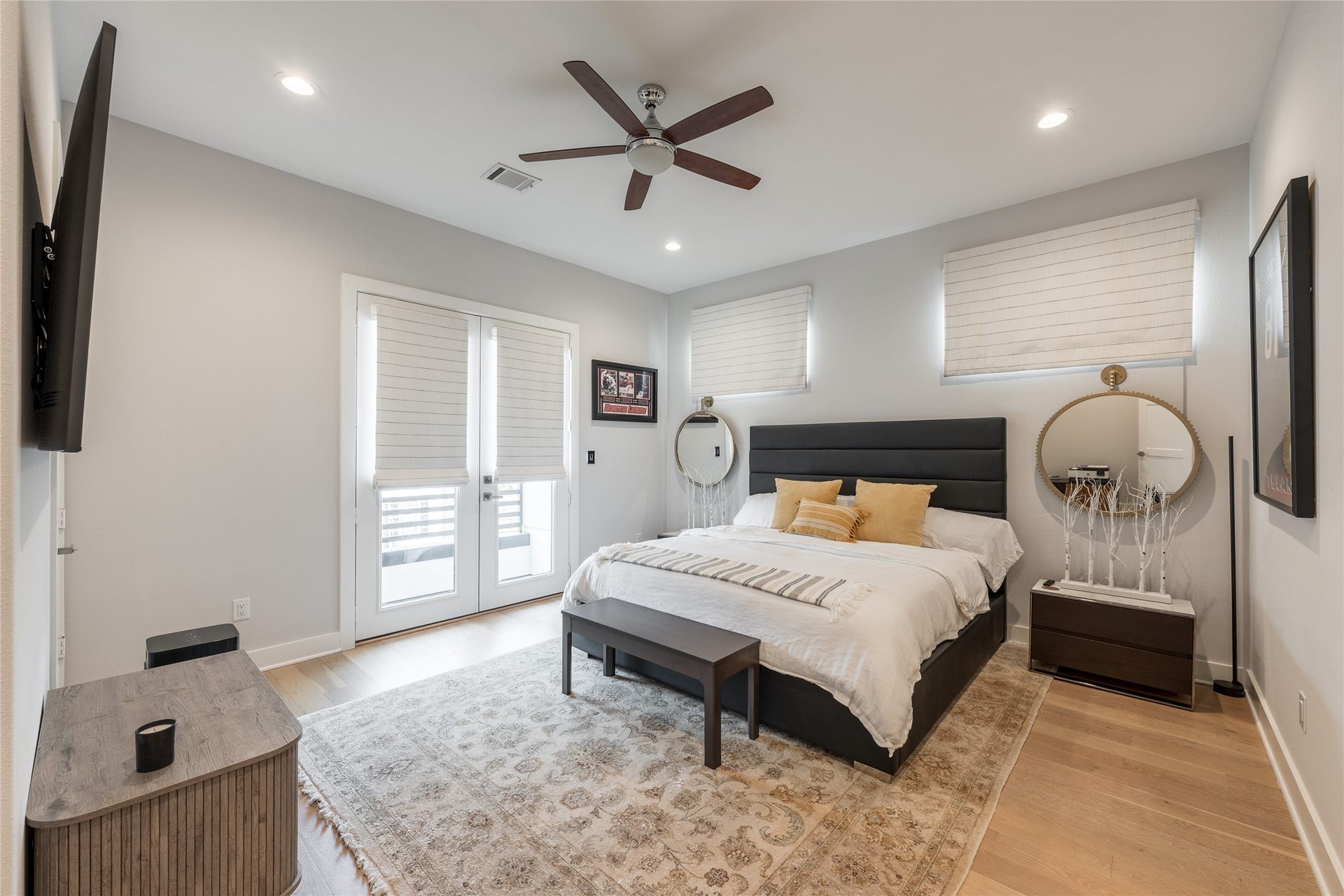 906 Knox Street, Houston, TX 77007 Light-filled and comfortably scaled, this secondary bedroom pairs warm wood flooring with multiple exposures and direct access to the covered balcony.