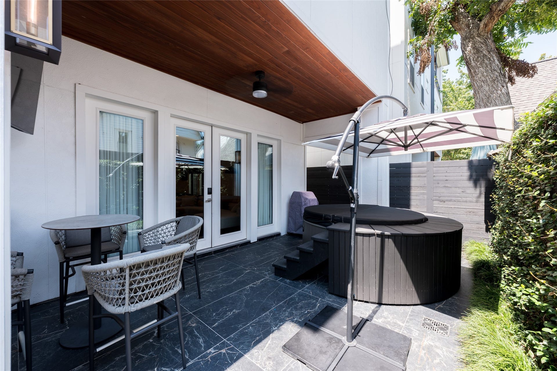 906 Knox Street, Houston, TX 77007 A covered backyard patio adds another layer of usable living space, with tiled flooring, a warm wood-plank ceiling and privacy from neighboring homes.