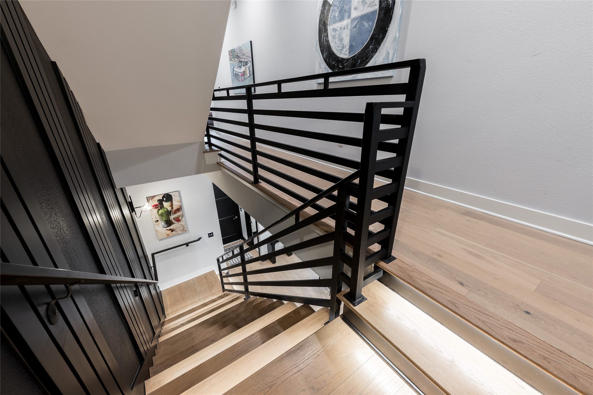906 Knox Street, Houston, TX 77007 More than a passage between floors, the staircase becomes an architectural feature through clean-lined metalwork, natural wood and thoughtfully integrated illumination.