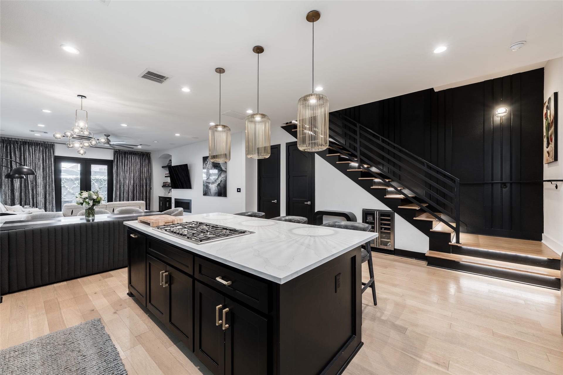 906 Knox Street, Houston, TX 77007 From the sculptural pendant lighting to the illuminated staircase, carefully considered details give the renovated interior a distinctive architectural character.