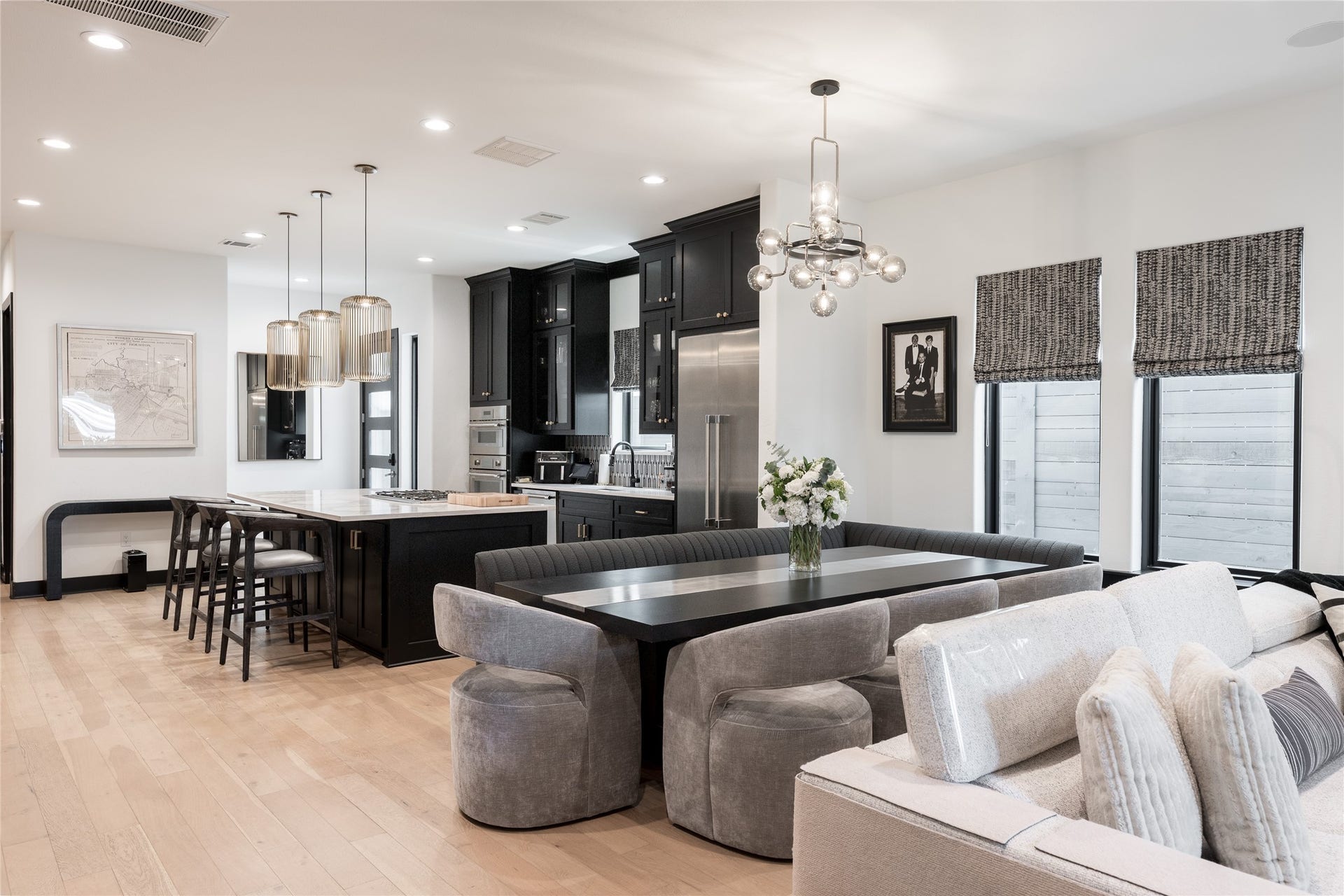 906 Knox Street, Houston, TX 77007 A wider perspective highlights the generous scale of the main living level, where the kitchen and dining areas remain visually connected while each retains its own defined space.