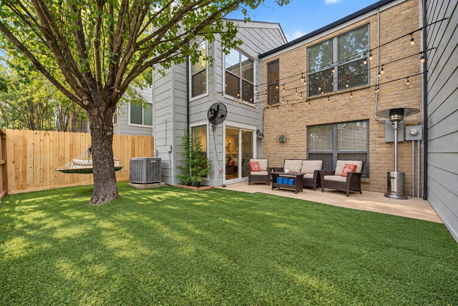 725 Worthshire Street, Houston, TX 77008 Fenced backyard with shade tree and inviting patio.
