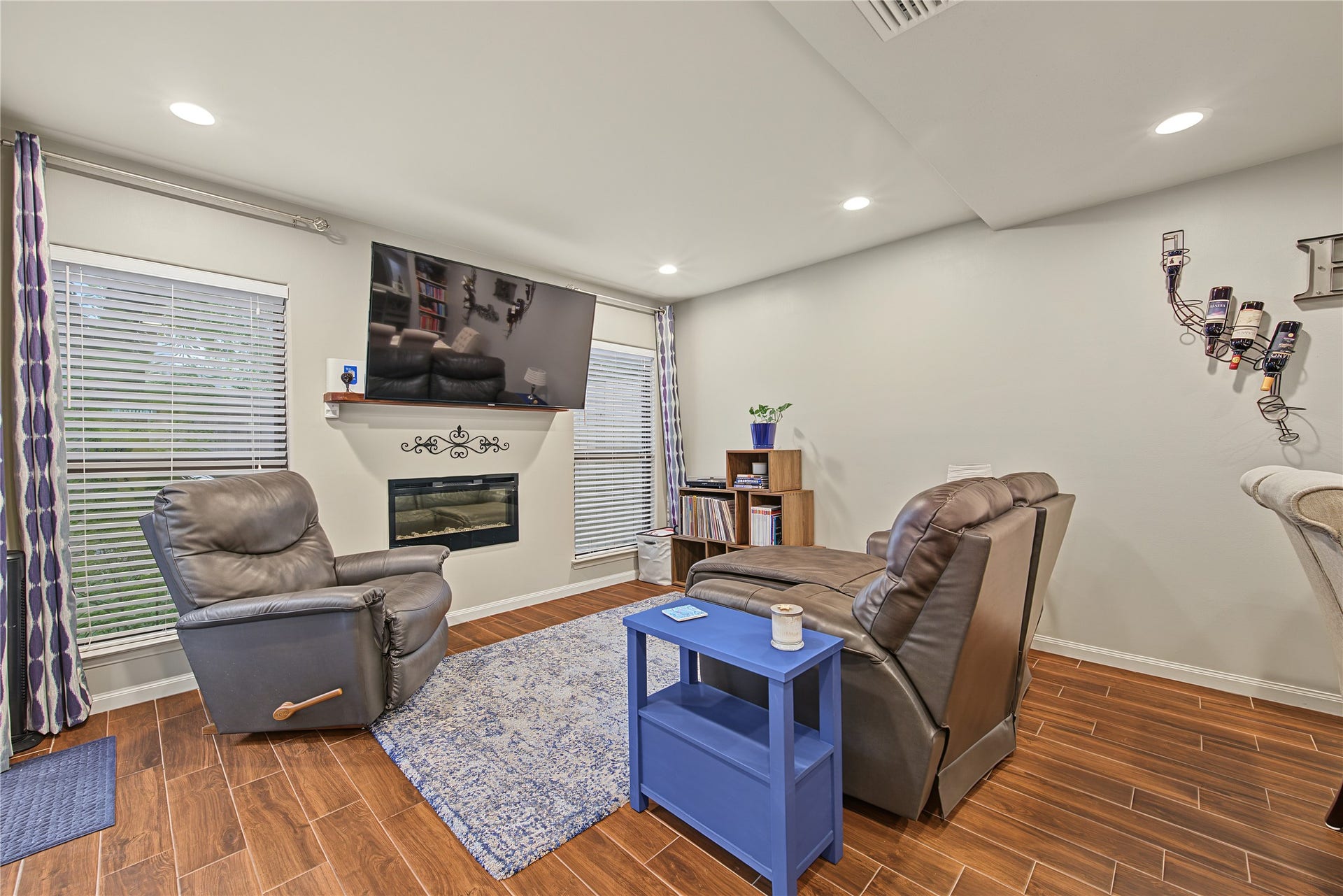 725 Worthshire Street, Houston, TX 77008 Inviting living room with fireplace and wood looking tile flooring