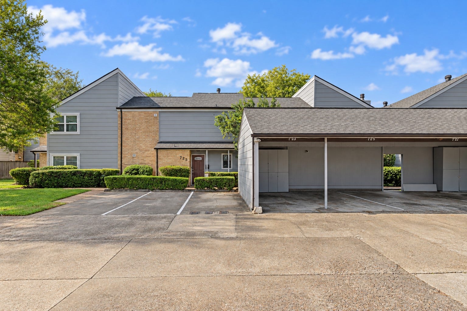 725 Worthshire Street, Houston, TX 77008 Front exterior showcasing townhome and covered parking area.