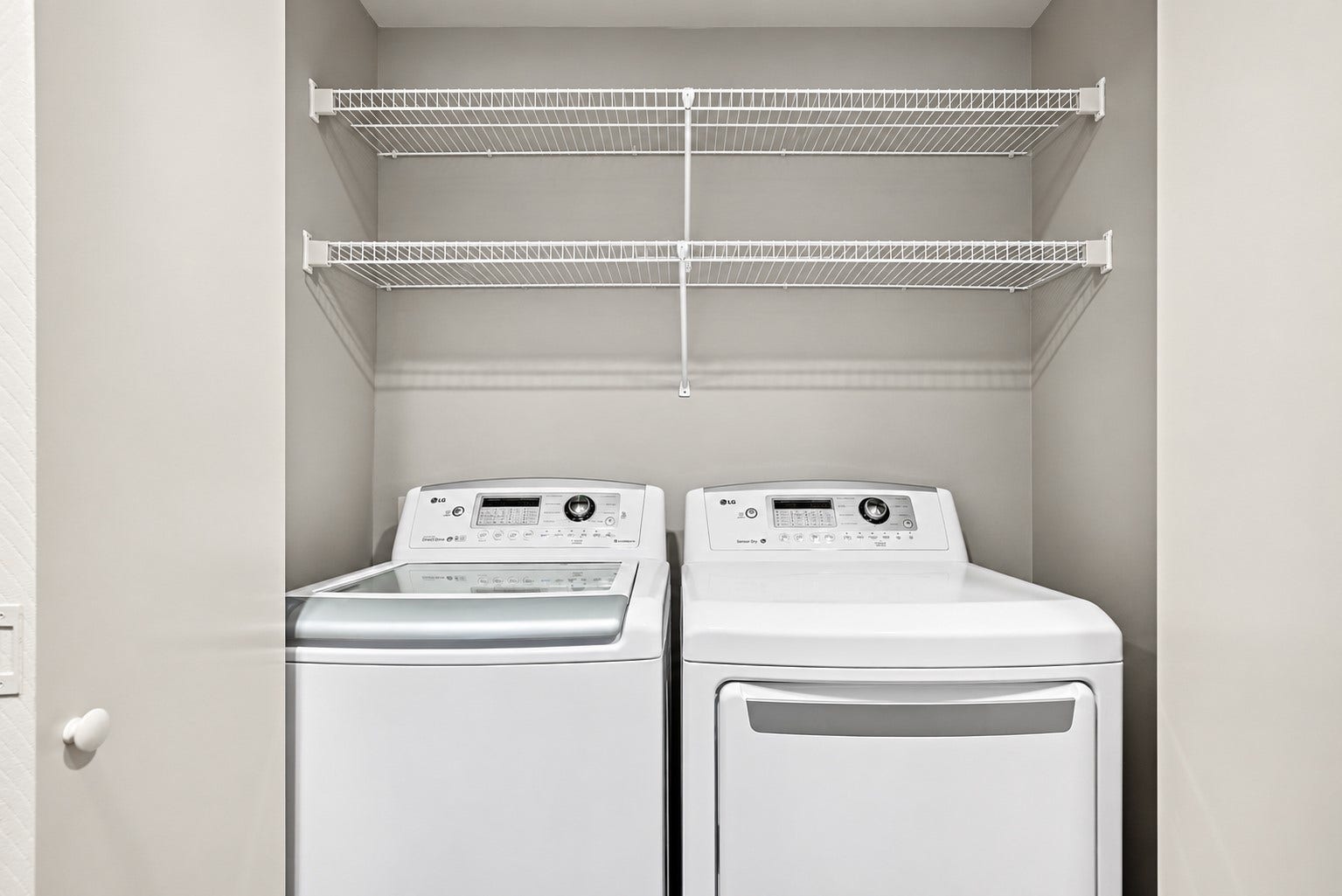 725 Worthshire Street, Houston, TX 77008 Convenient laundry area with overhead storage shelving.