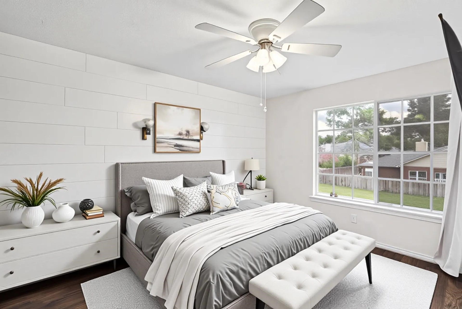 One of three secondary bedrooms upstairs, this inviting space features beautiful engineered hardwood floors and One of three secondary bedrooms upstairs, this inviting space features beautiful engineered hardwood floors, windows that fill the room with natural light, and a ceiling fan for added comfort.