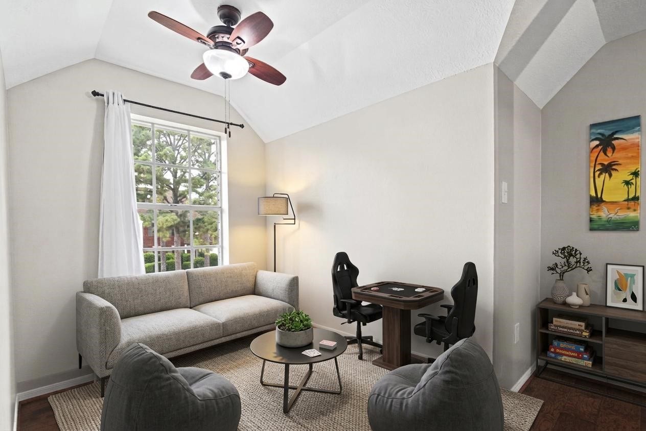 At the top of the stairs, you'll find a charming game room featuring beautiful engineered hardwood floors. This versatile space is perfect for a playroom, entertainment area, or cozy spot to relax and enjoy family time.
