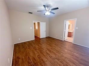 14420 Birch Knoll Lane, Houston, TX 77047 Primary bedroom is spacious with ceiling fand and beautiful floors