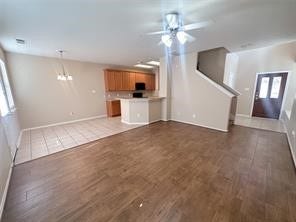 14420 Birch Knoll Lane, Houston, TX 77047 Entry into family room with recently installed wood floors and fresh paint. Powder/guest restroom on first floor