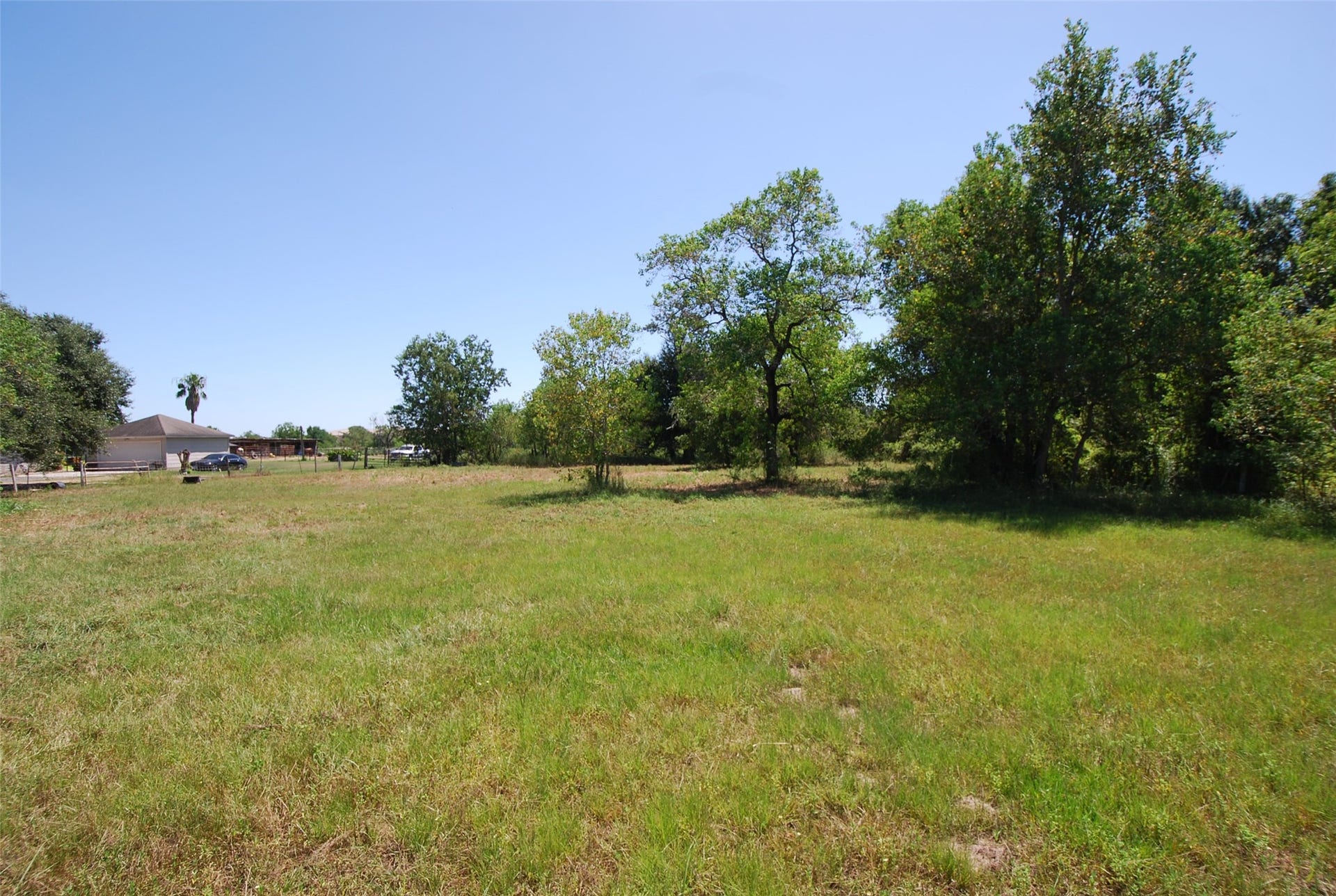 0 Fulshear Katy Road, Fulshear, TX 77441 his was taken from Fulshear-Katy Road and is looking at the center of the Lot, east towards the schools.