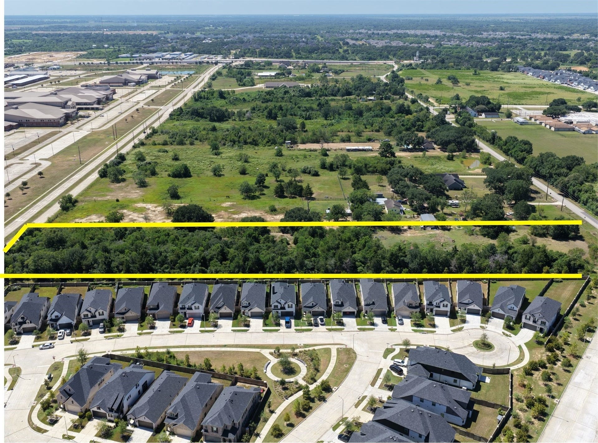 0 Fulshear Katy Road, Fulshear, TX 77441 Here, is a view looking south over the Lot towards FM 1093. Notice the schools on the left and a peek of Huggins Elementary on the right.