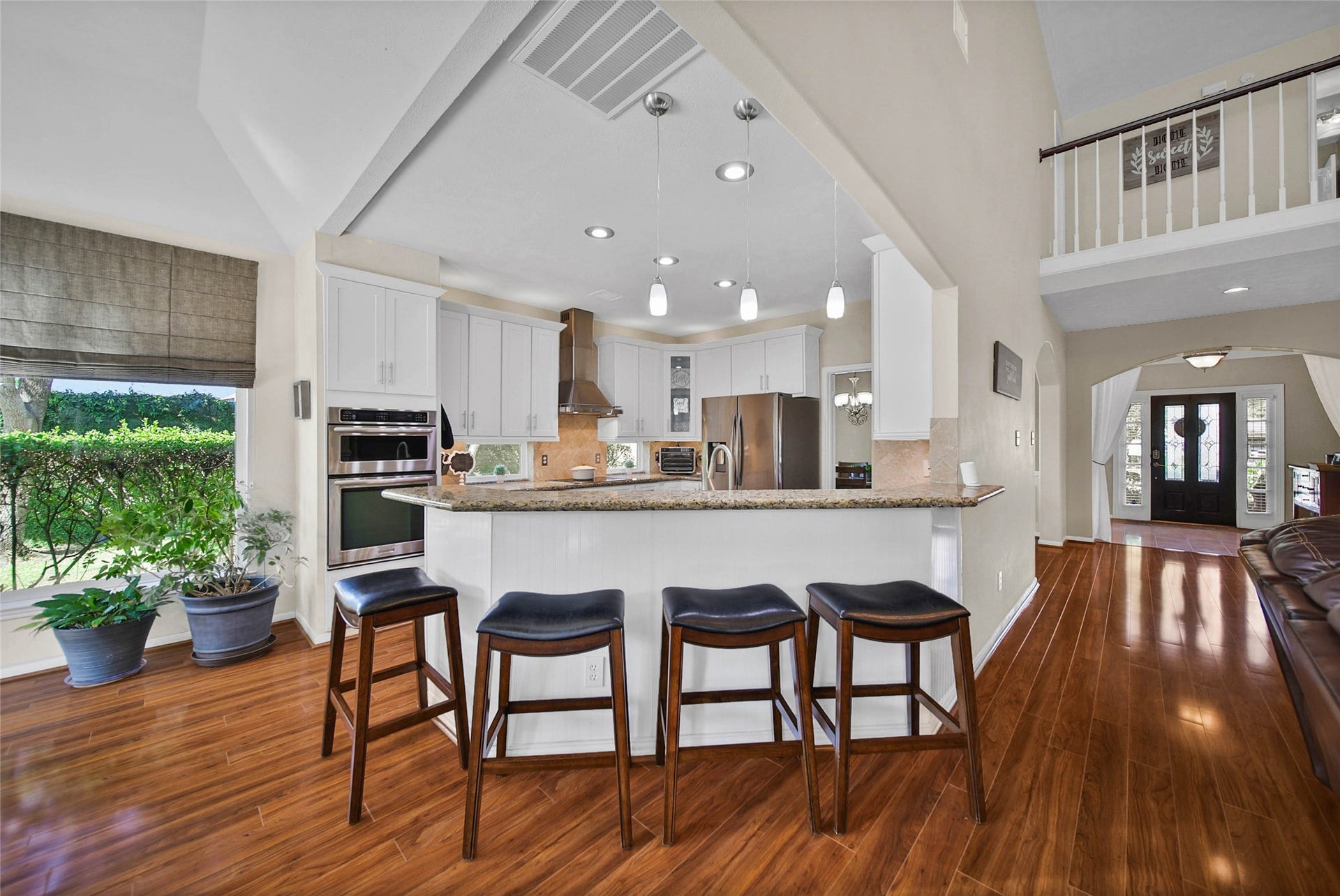 5206 Evergreen Valley Drive, Kingwood, TX 77345 The functional breakfast bar is an easy spot for extra seating!