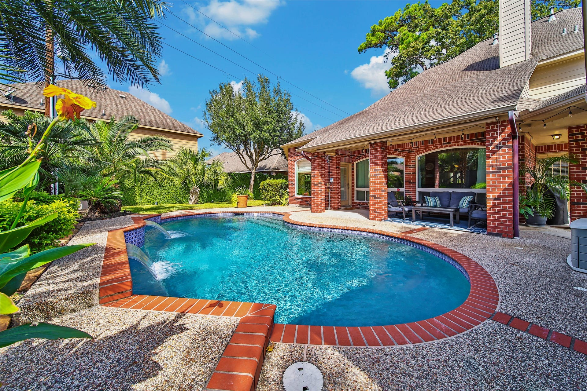 5206 Evergreen Valley Drive, Kingwood, TX 77345 Gorgeous landscaping makes this feel like your own personal tropical oasis!