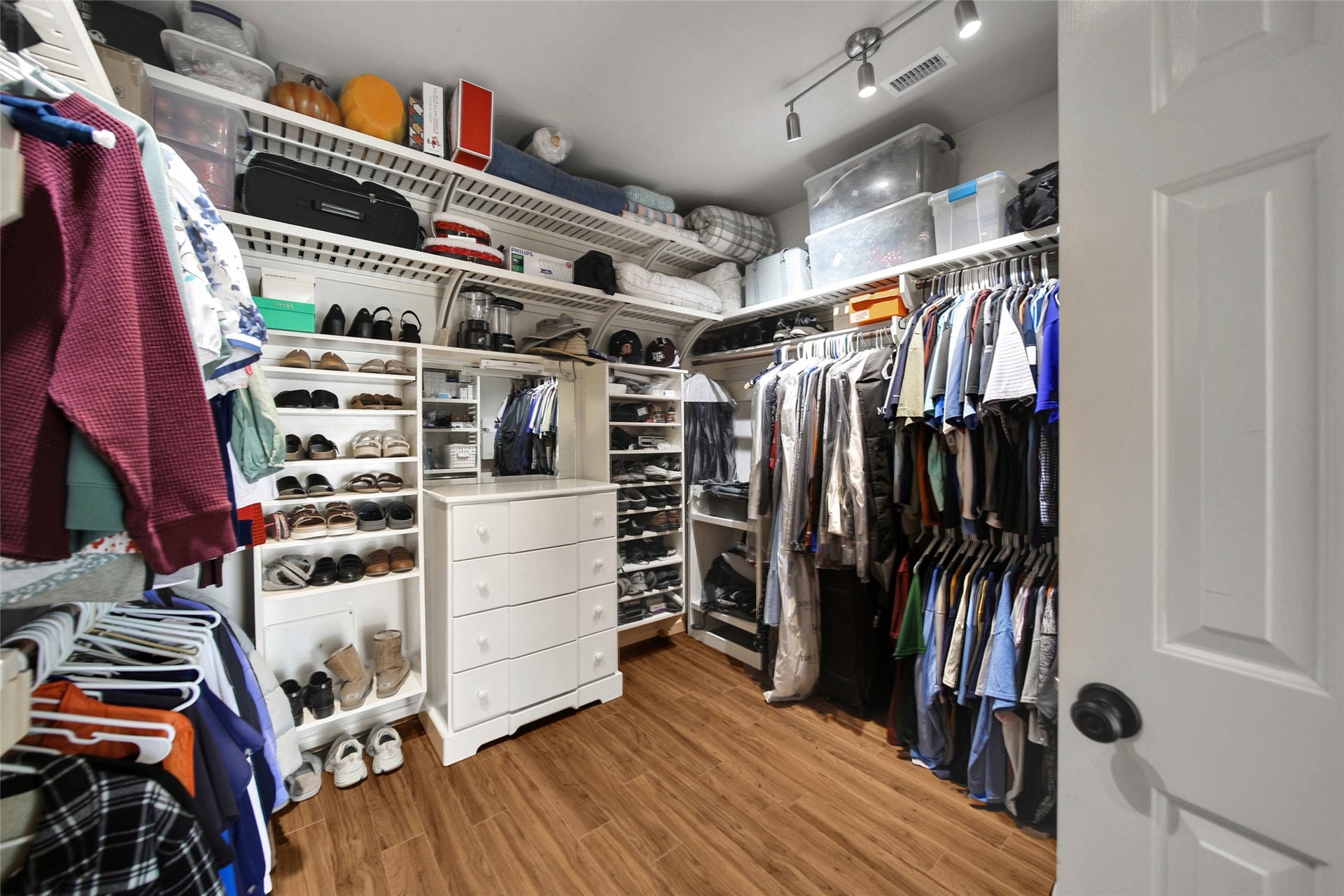 5206 Evergreen Valley Drive, Kingwood, TX 77345 The primary walk-in closet has a well thought out space for everything.