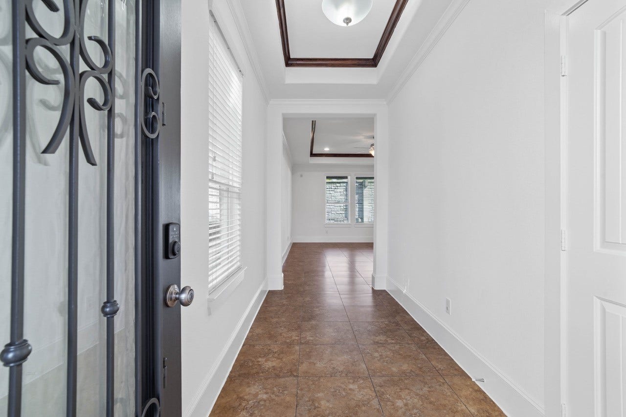 6724 Keats Street, #B, Houston, TX 77085 Inside the home with a hallway entrance to the left is the half bath