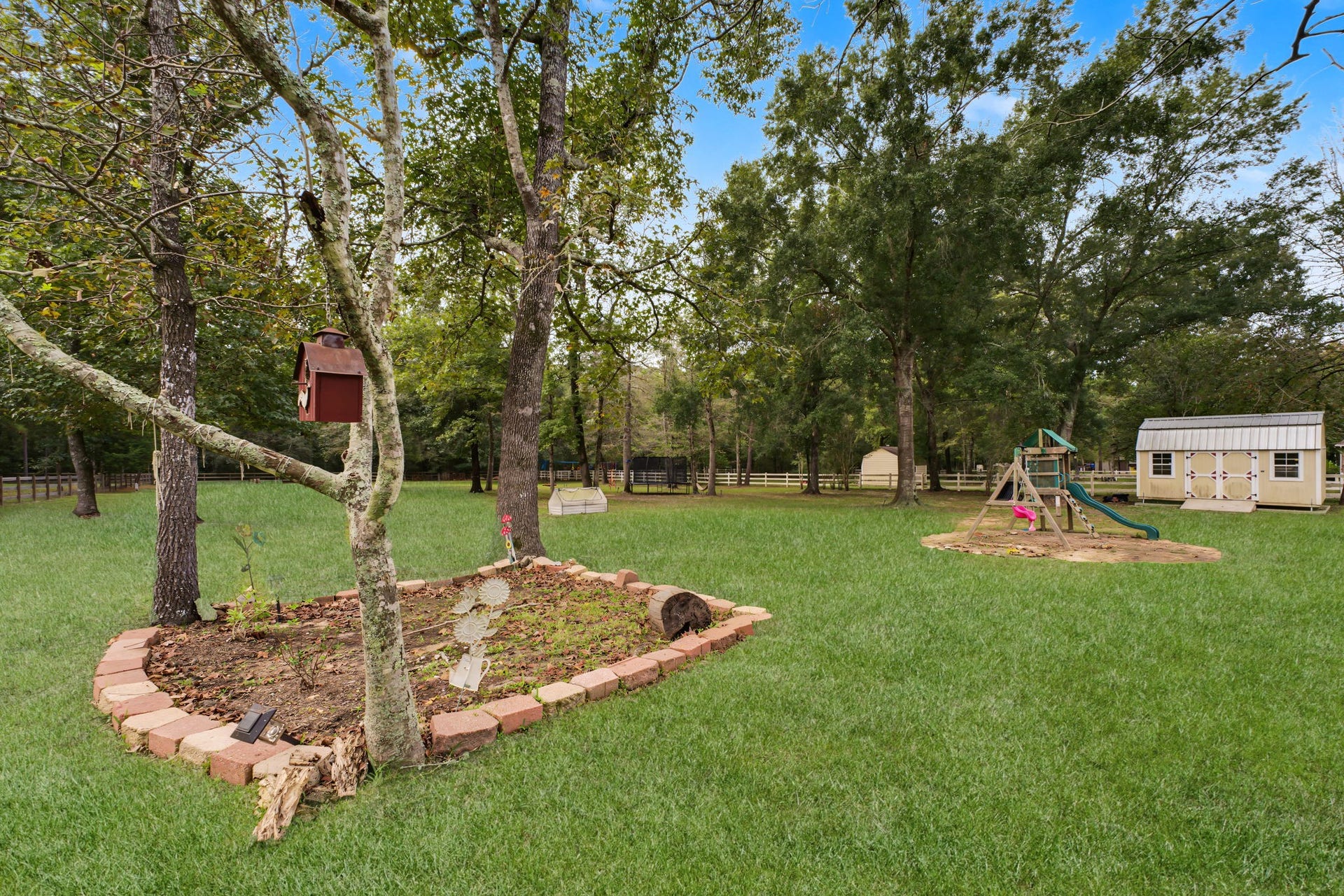 421 Trace Way Drive, Montgomery, TX 77316 Mature trees, room for a pool, garden and a new shop.
