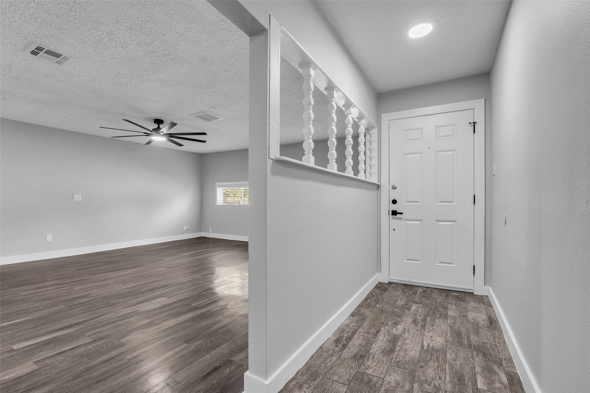 Step inside to wood-look plank flooring, with the family room just off the entry.
