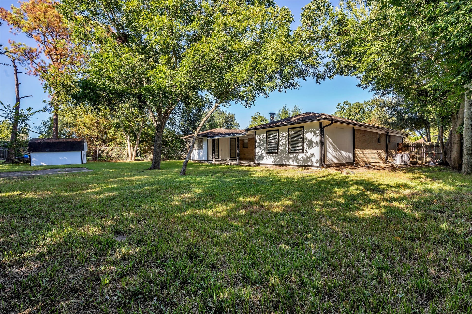 Room to garden, play or entertain in the expansive backyard, framed by mature trees.