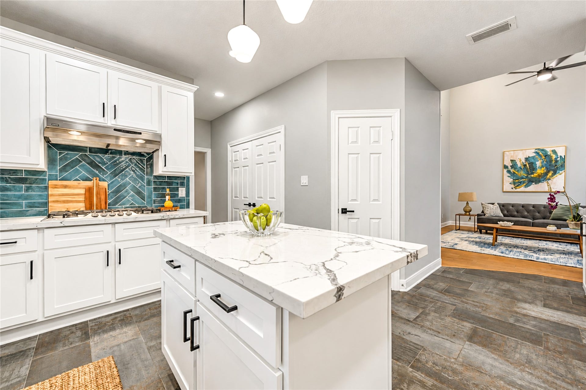 14215 Edinburgh Court, Houston, TX 77077 The heart of the home, where cooking and connection come together! This beautifully renovated kitchen features a spacious island, quartz countertops, stainless steel appliances and crisp white cabinetry. Open to the adjoining living space, it's perfect for preparing family favorites while staying connected to the conversation or hosting friends with ease!