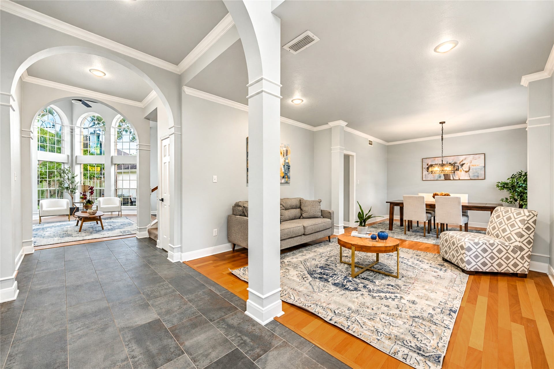 14215 Edinburgh Court, Houston, TX 77077 First impressions are everything! Just off the entry, this elegant formal living room offers endless possibilities. Create a sophisticated space for entertaining, a cozy sitting room for quiet conversations or a stylish retreat that perfectly reflects your lifestyle. Beautiful architectural details and natural light make this versatile space truly inviting!
