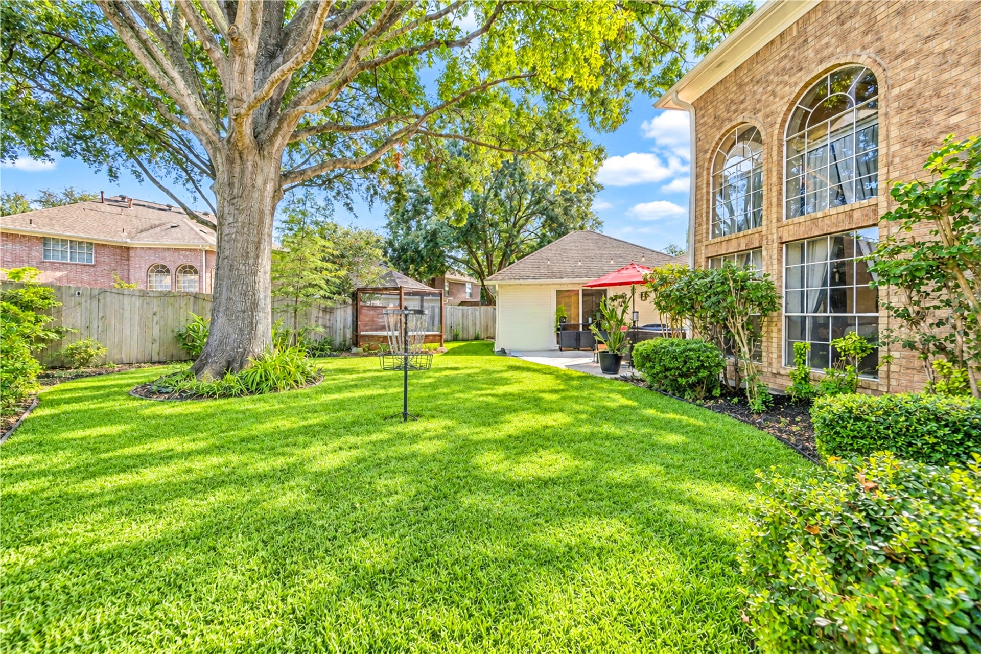 14215 Edinburgh Court, Houston, TX 77077 Your own backyard retreat awaits! Towering mature trees provide beautiful shade over an expansive lawn, creating the perfect setting for weekend gatherings, outdoor play or simply relaxing with your morning coffee while enjoying the peaceful surroundings.