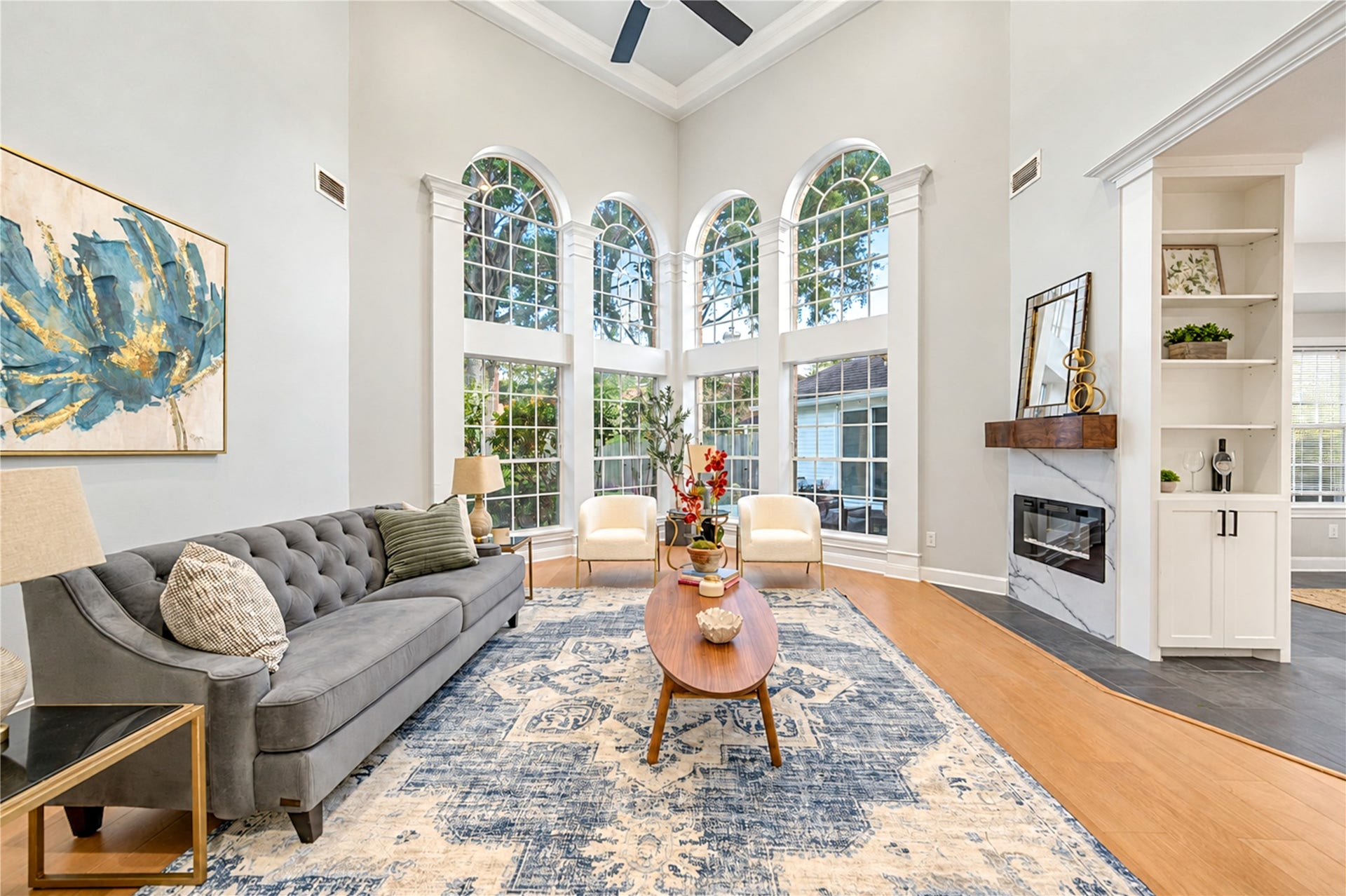 14215 Edinburgh Court, Houston, TX 77077 The perfect place to relax, reconnect and make lasting memories! This stunning family room features soaring ceilings, beautiful arched windows that fill the space with natural light and a cozy fireplace. Whether enjoying movie nights, gathering with friends or simply unwinding after a busy day, this inviting space makes everyday living feel extraordinary!