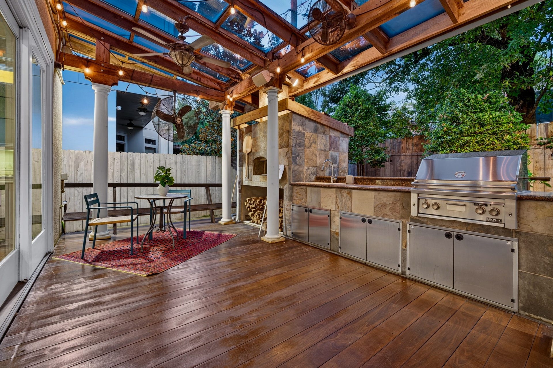 4420 Darsey Street, Bellaire, TX 77401 A built-in pizza oven adds a distinctive touch to the patio, with nearby space for outdoor dining.