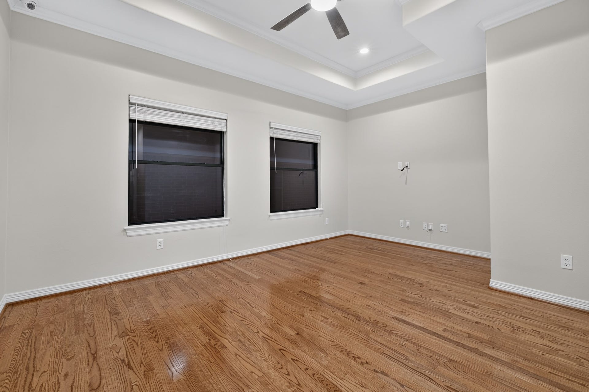 4420 Darsey Street, Bellaire, TX 77401 Another view of this spacious bedroom highlights its two windows and flexible layout, with the option to use it as a game room.