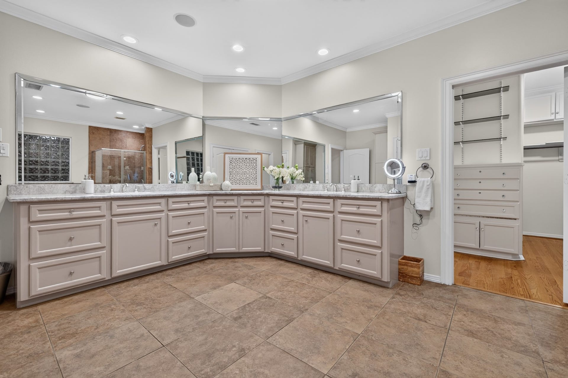 4420 Darsey Street, Bellaire, TX 77401 The primary bathroom's extended vanity provides ample counter space and drawers for everyday essentials.