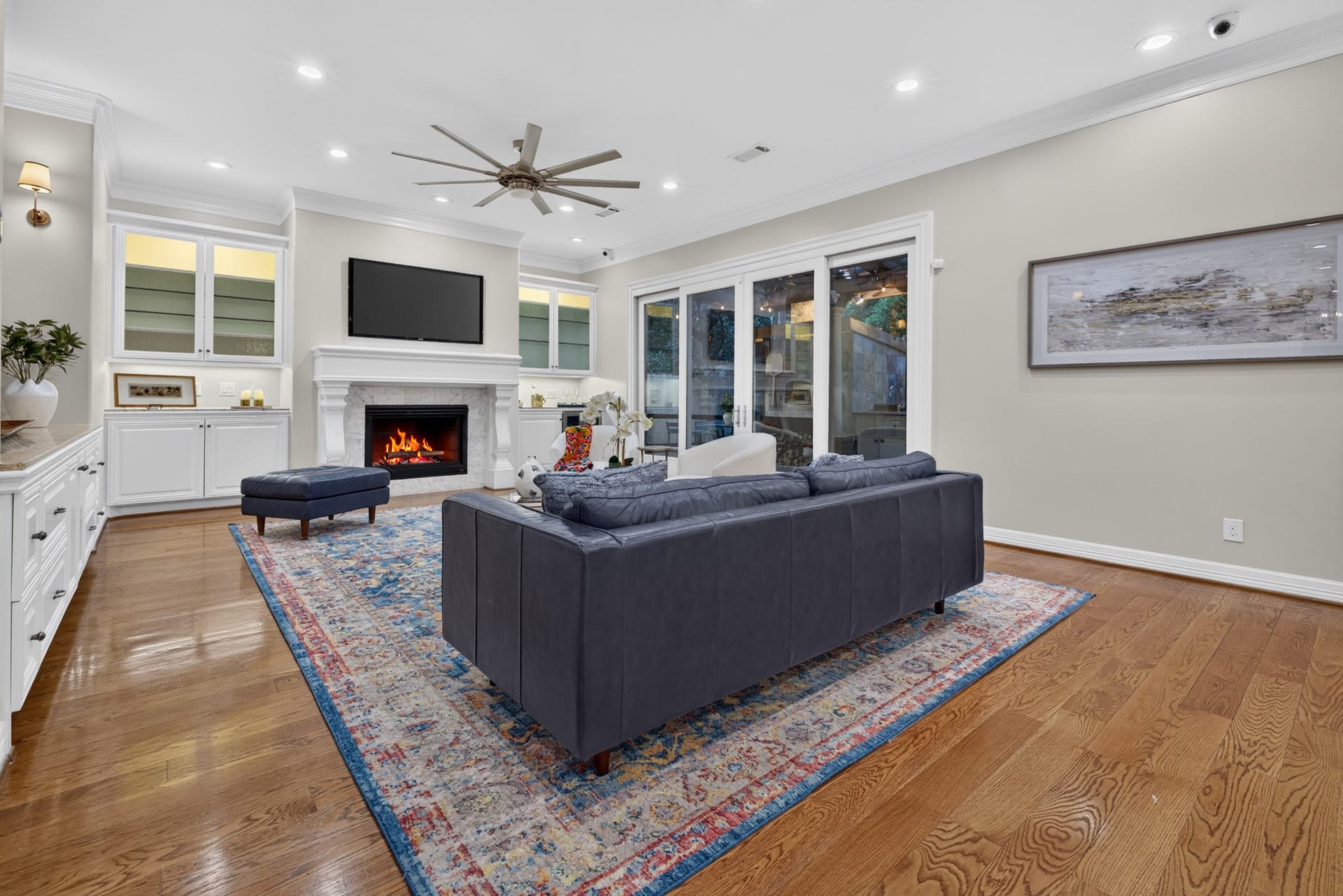 4420 Darsey Street, Bellaire, TX 77401 A fireplace framed by built-in cabinetry serves as the family room's focal point.