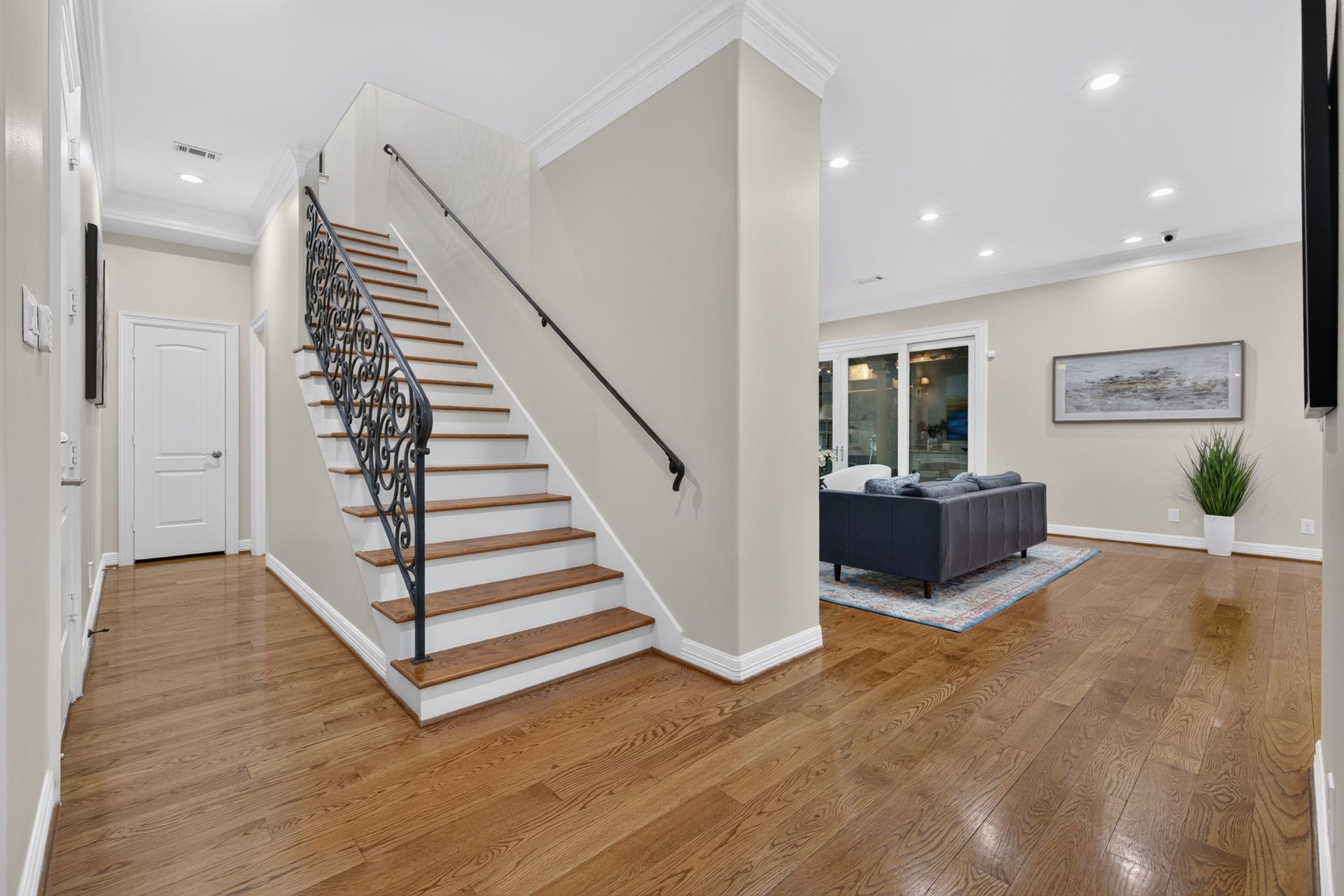 4420 Darsey Street, Bellaire, TX 77401 The central staircase sits beside the family room, with a convenient powder bath located down the hall.