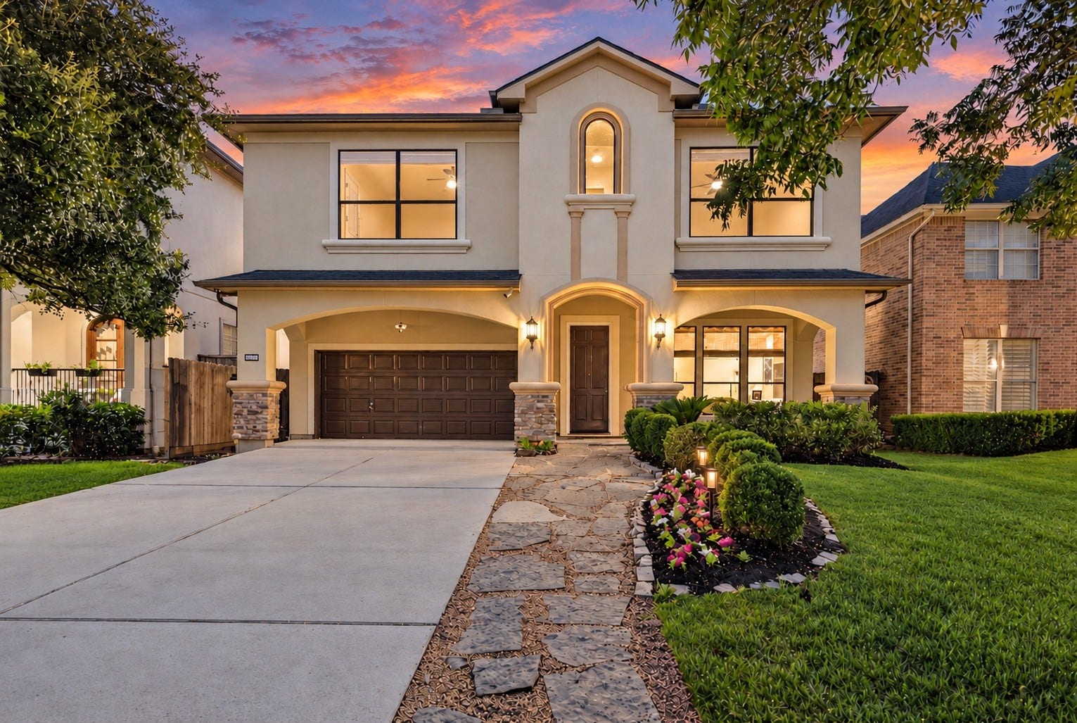 4420 Darsey Street, Bellaire, TX 77401 Twilight at 4420 Darsey highlights the home's inviting exterior, mature trees and beautifully landscaped front yard.
