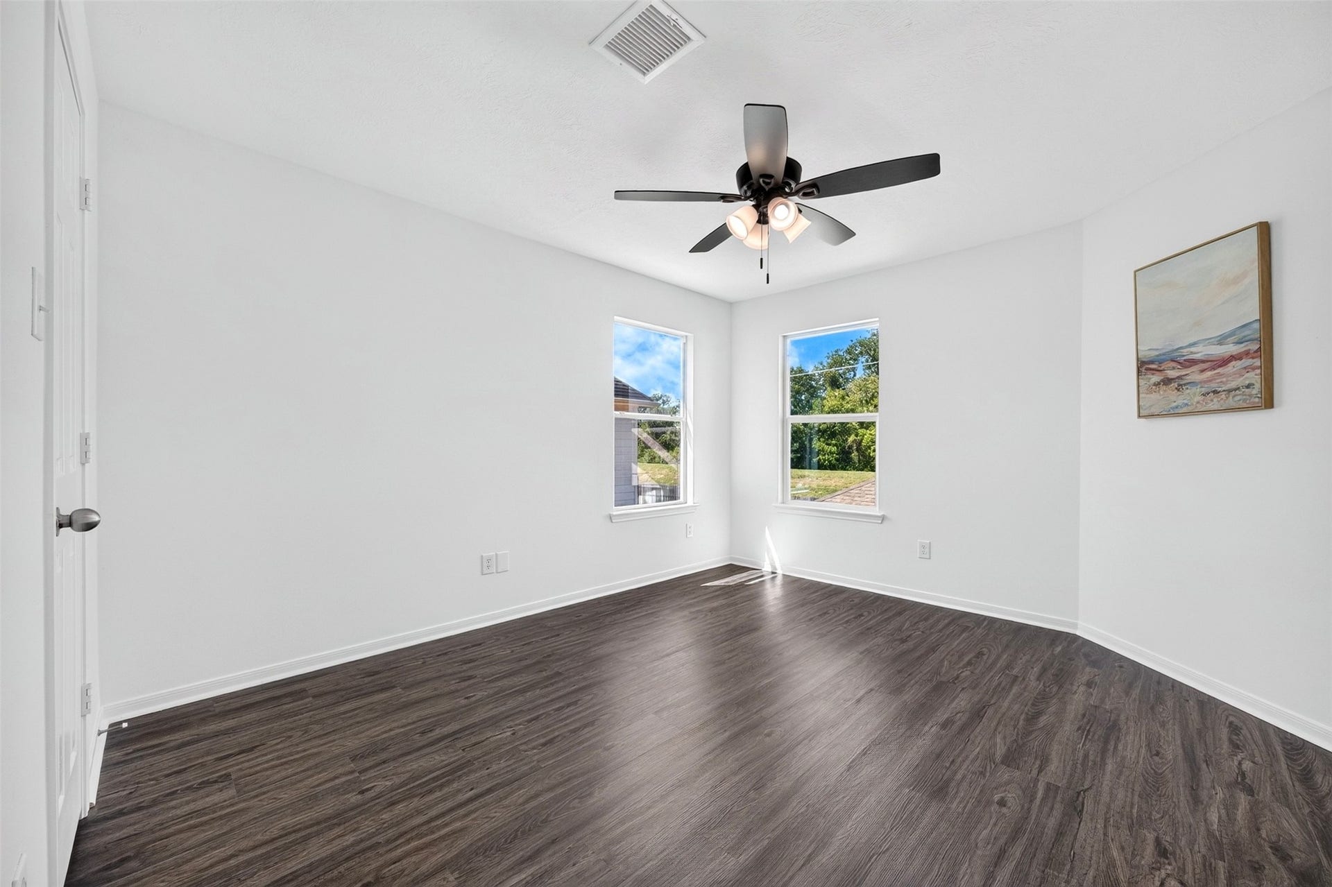 3114 Brannon Hill Lane, Sugar Land, TX 77479 Bedroom with two windows for natural light and a NEW ceiling fan.