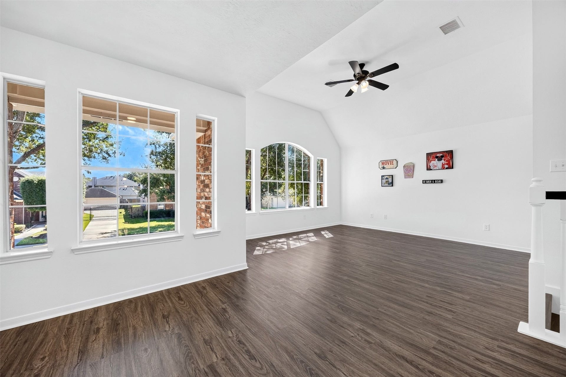 3114 Brannon Hill Lane, Sugar Land, TX 77479 Bright and spacious game room area featuring large windows that provide abundant natural light and a stylish ceiling fan.