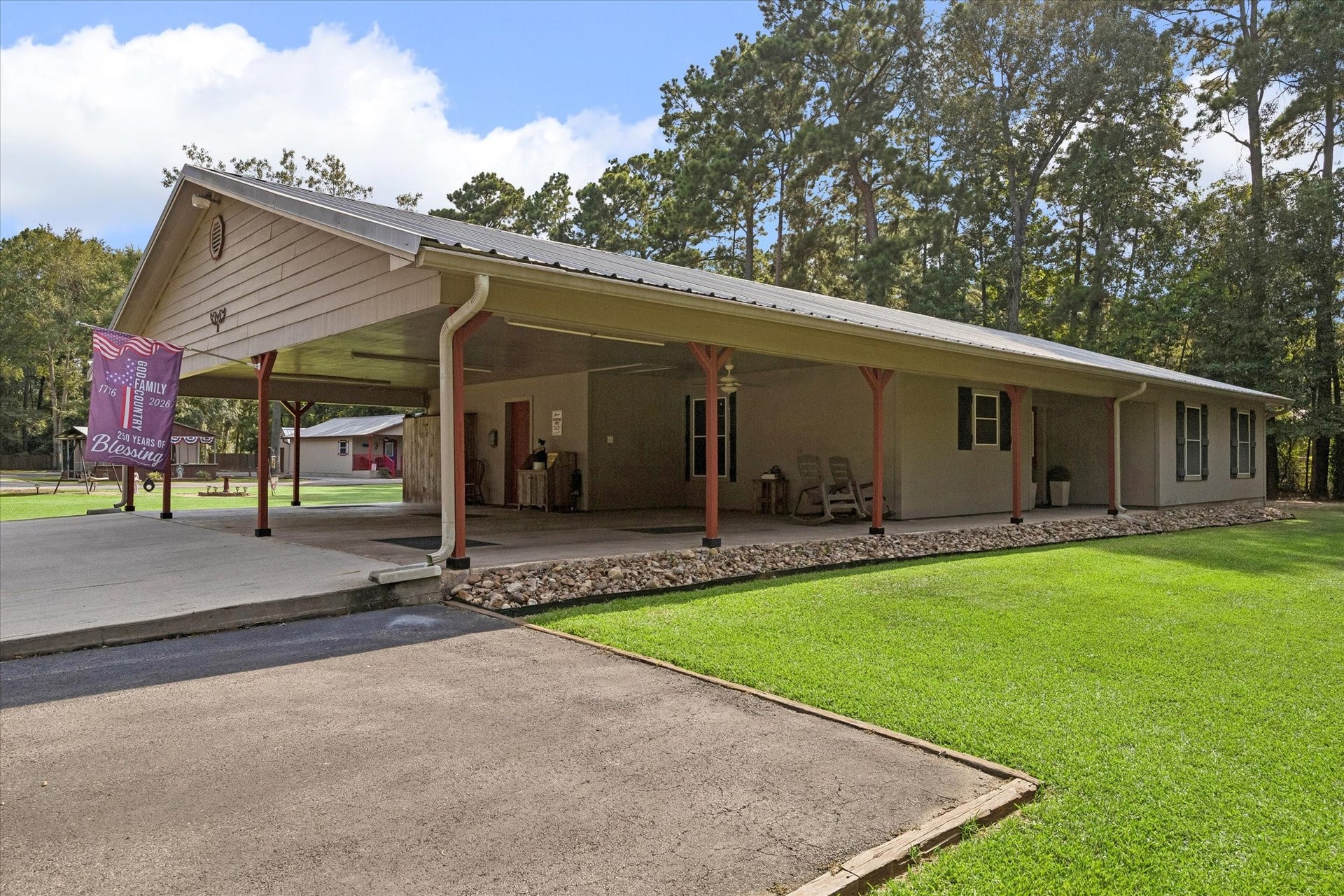26904 Brentwood Road, Splendora, TX 77372 The Main House with 3 car carport. Flooring is stamped concrete