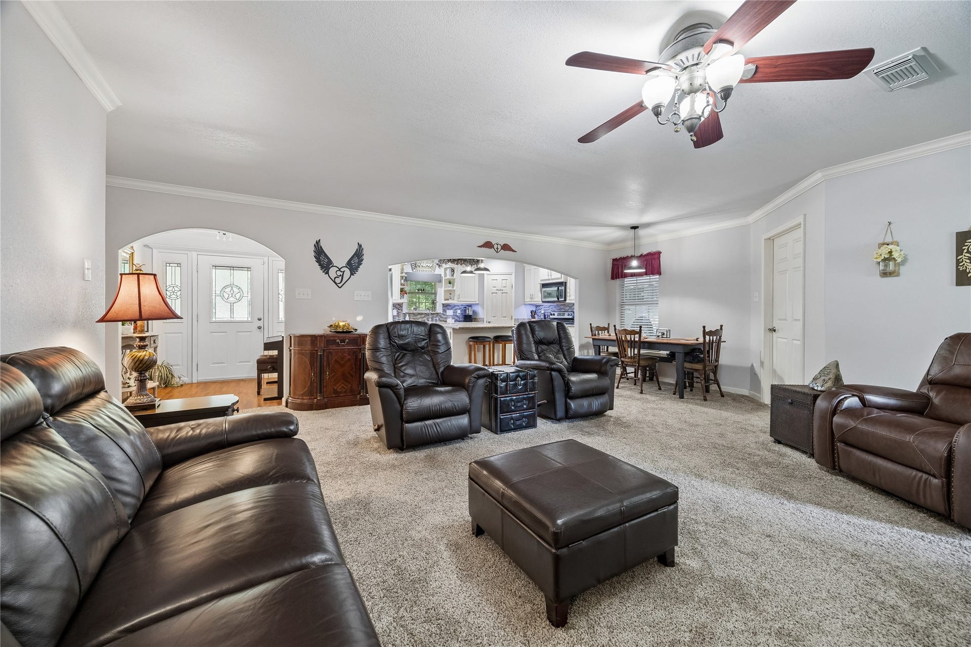 26904 Brentwood Road, Splendora, TX 77372 A seamless view of the living room, front entryway, and a glimpse into the kitchen
