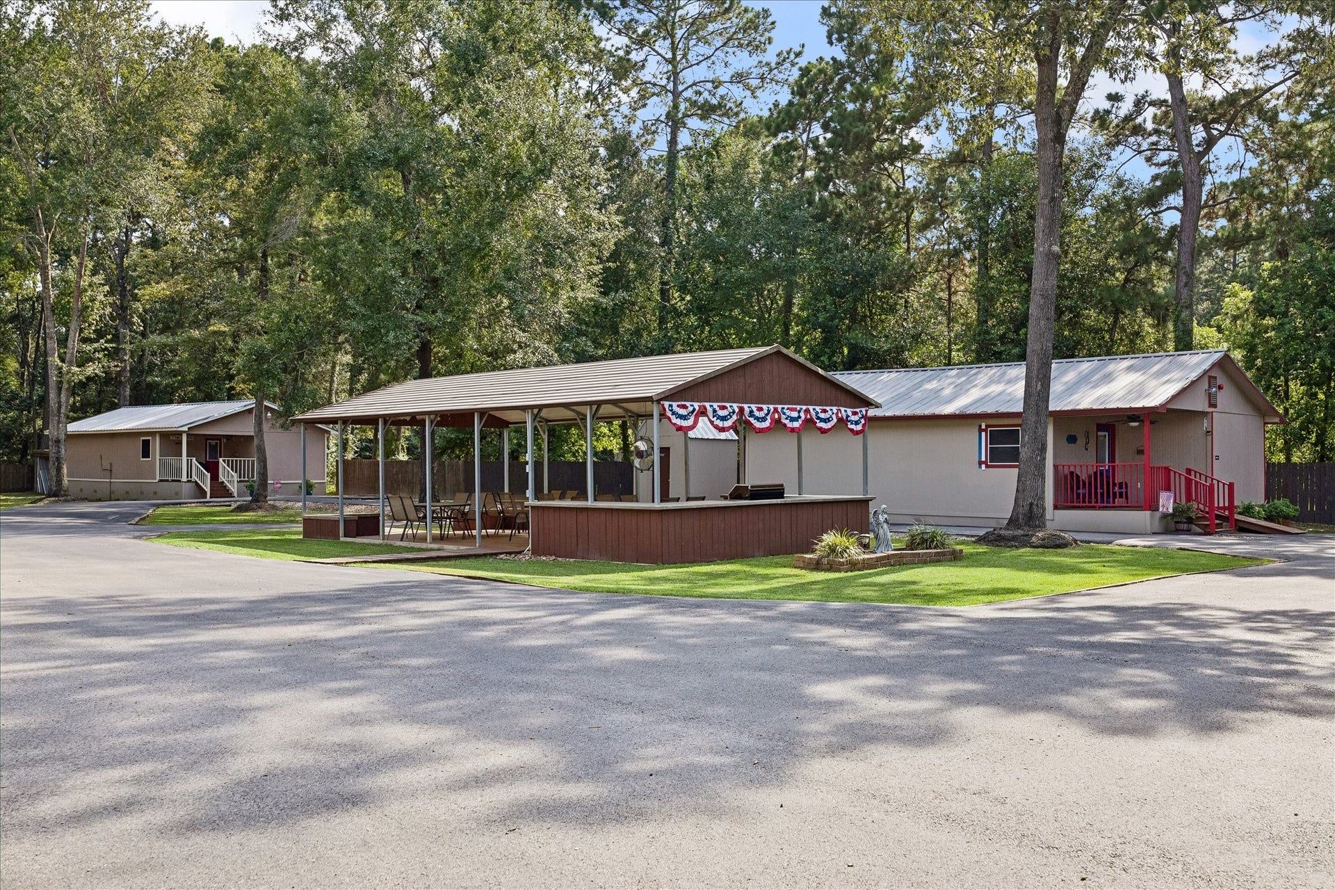 26904 Brentwood Road, Splendora, TX 77372 View of the pavilion & 2 cottages.
