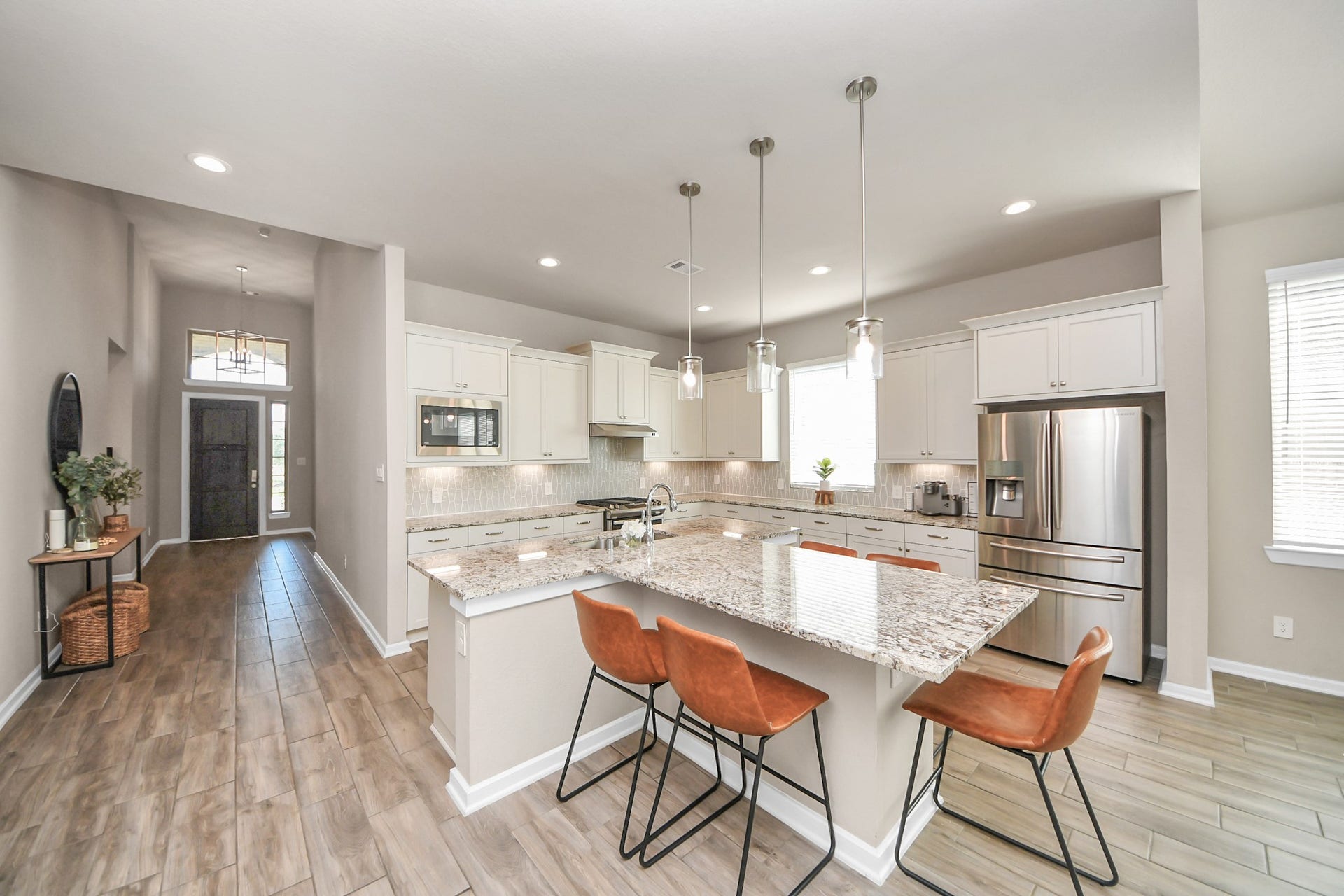 4734 Franklin Way, Iowa Colony, TX 77583 T-shaped island is great for quick meals or meal prep.