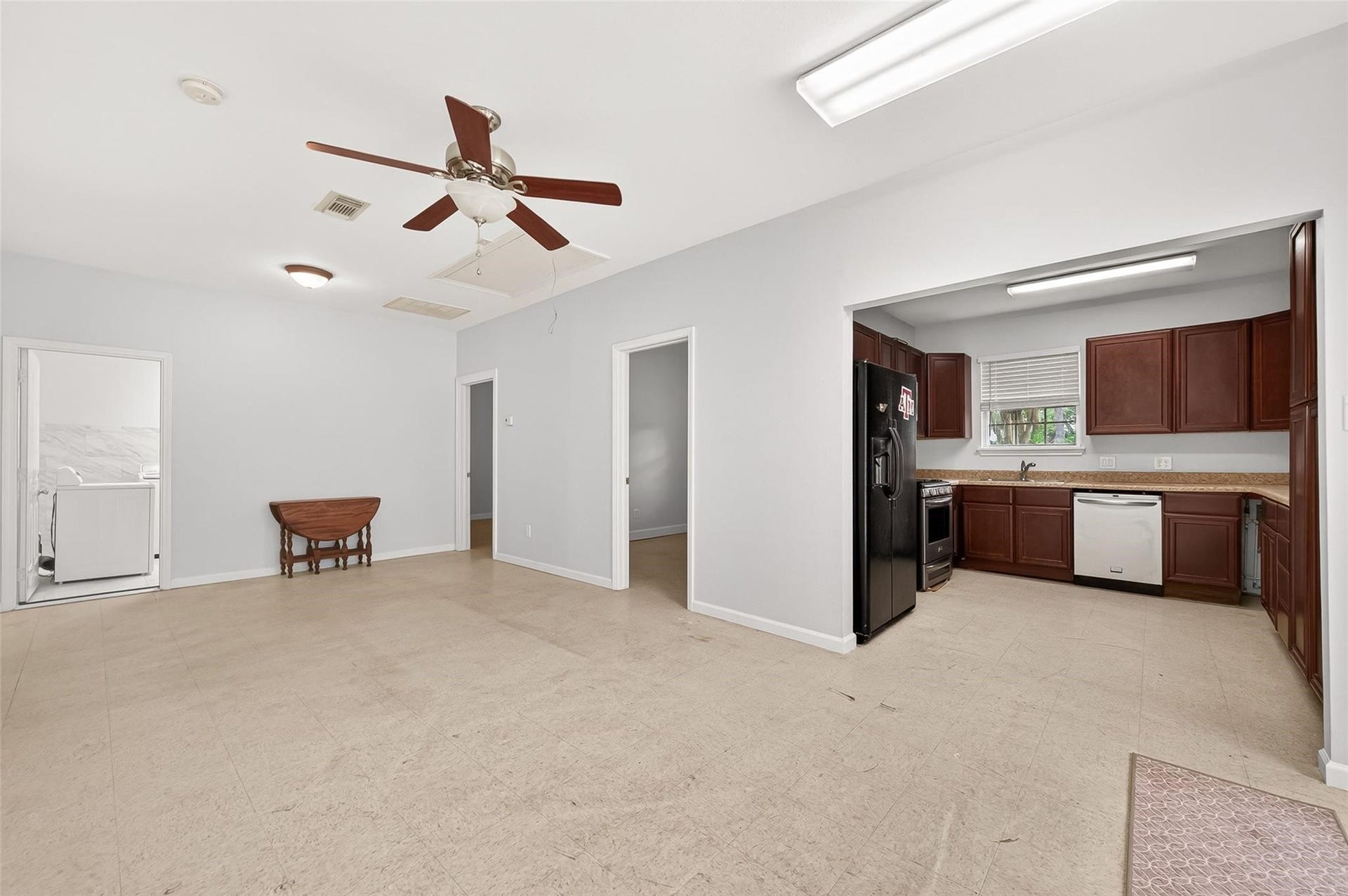 The garage is located on the side of the house with a huge driveway and additional private guest house parking.