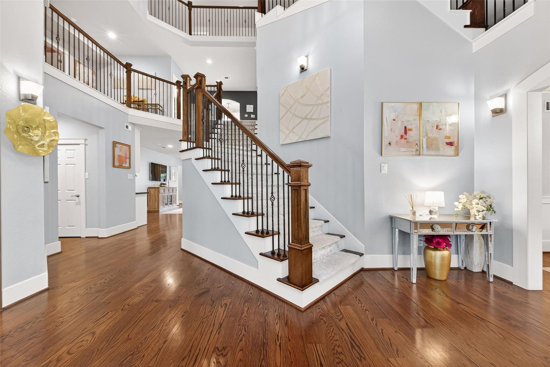 Dining room is to the right and study to the left. Custom carpet runner on the stairs is a true statement piece.