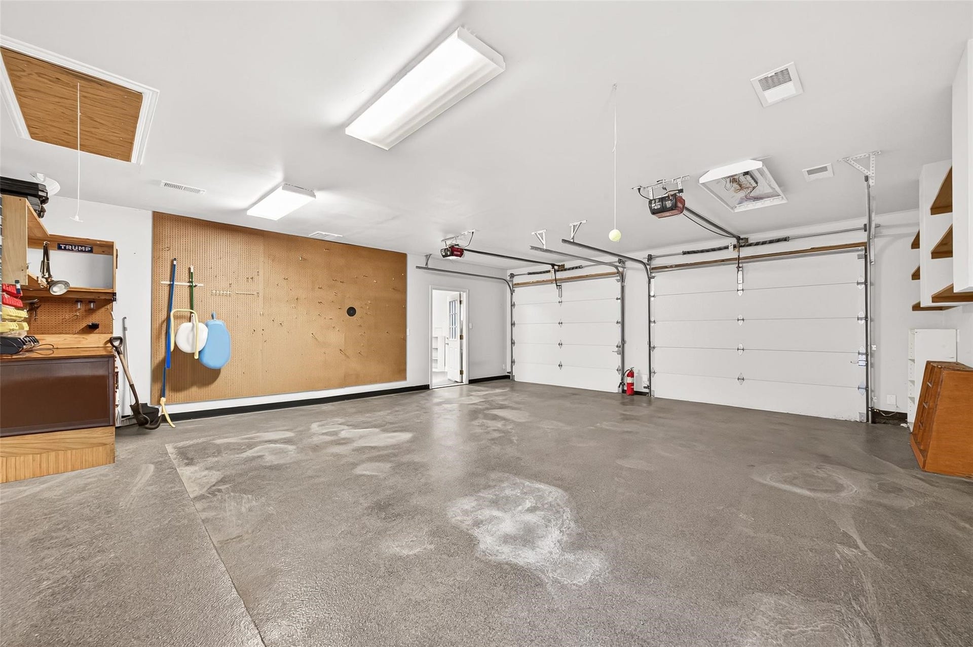 Garage features epoxy flooring and workstation