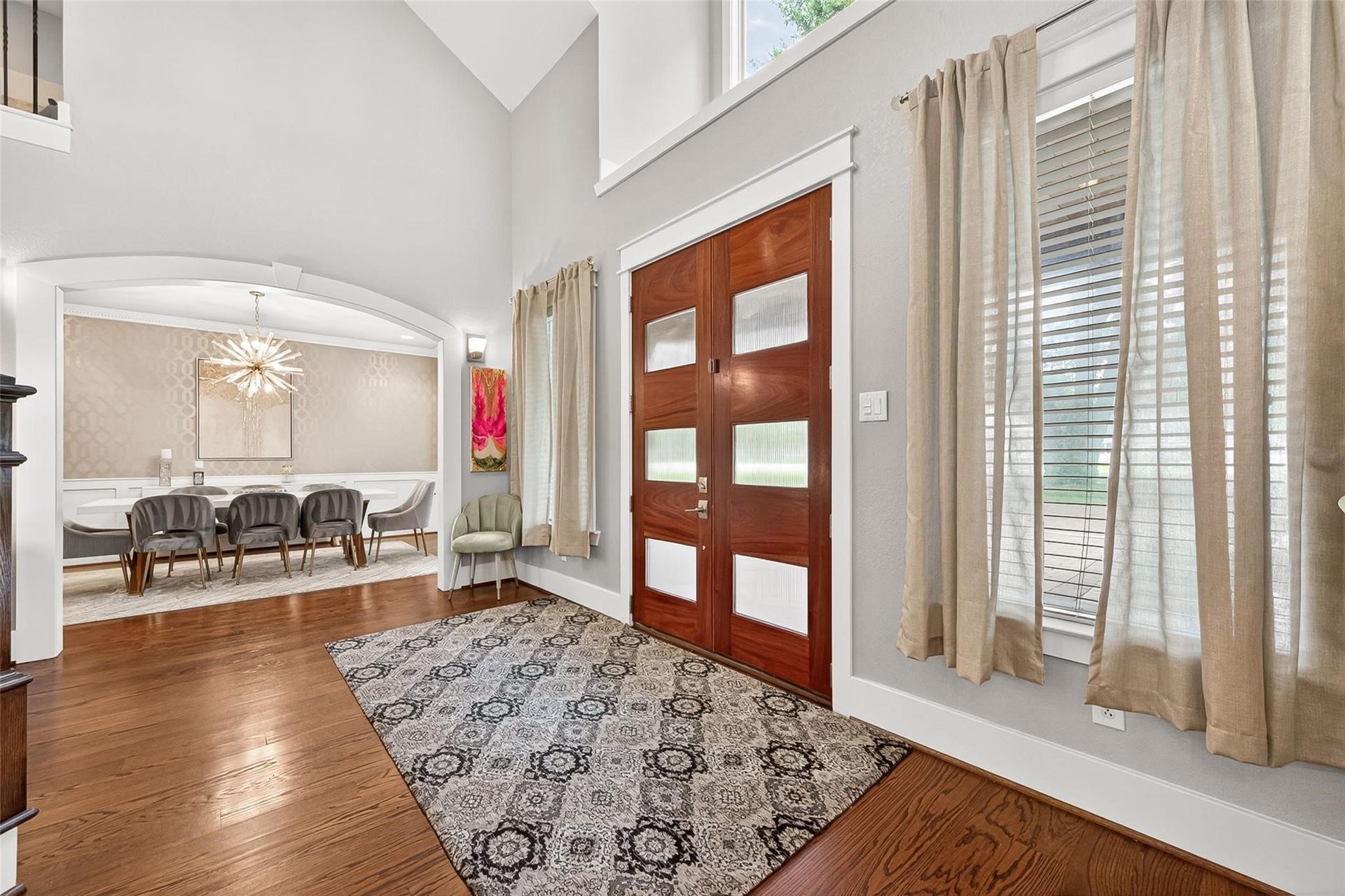 Upon entry, you are greeted with soaring ceilings, modern fixtures, real hardwoods throughout.