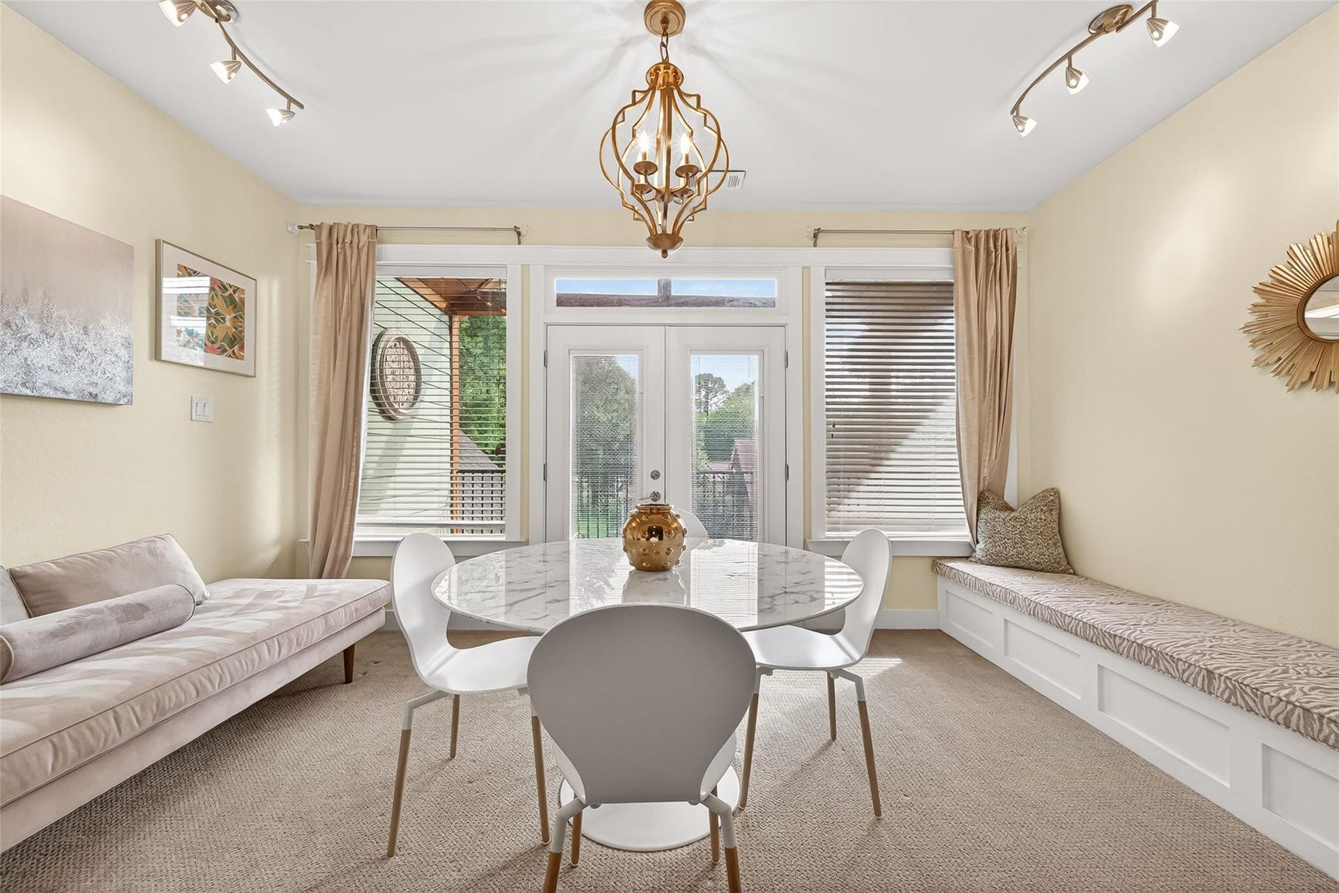 This "sunroom" flex room is located on the 2nd floor and is the perfect space for a music room, homeschool classroom. The doors lead you to a spacious balcony overlooking the backyard.