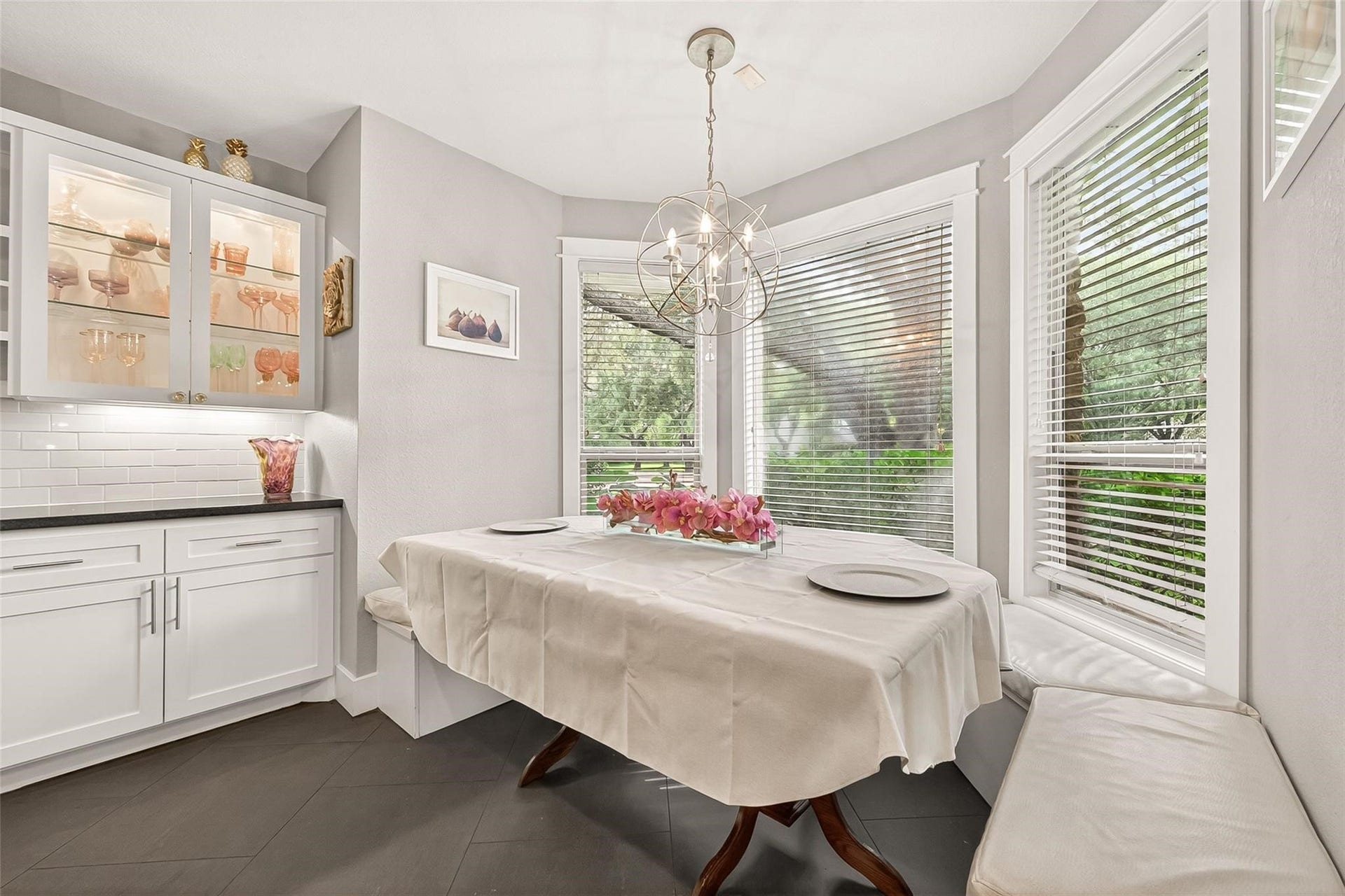 The custom breakfast nook with a beautiful side yard view.